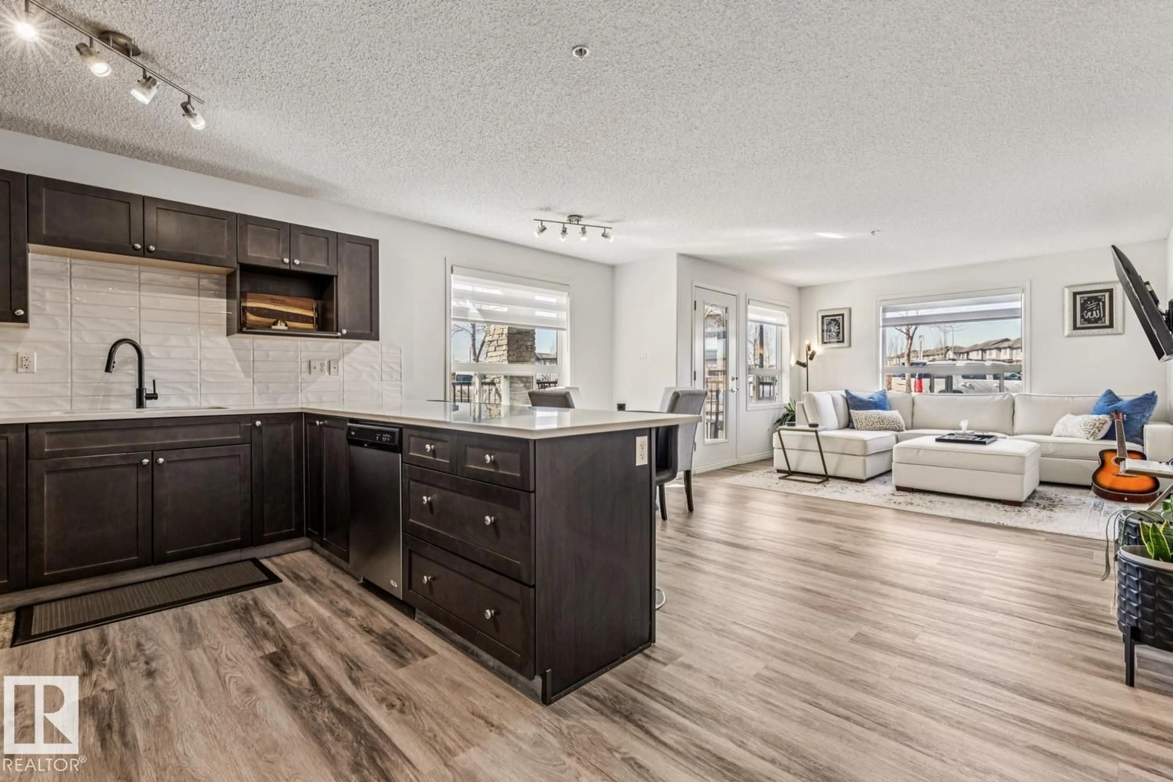 Open concept kitchen, wood/laminate floor for #147 - 1520 HAMMOND GATE GA, Edmonton Alberta T6M0J4