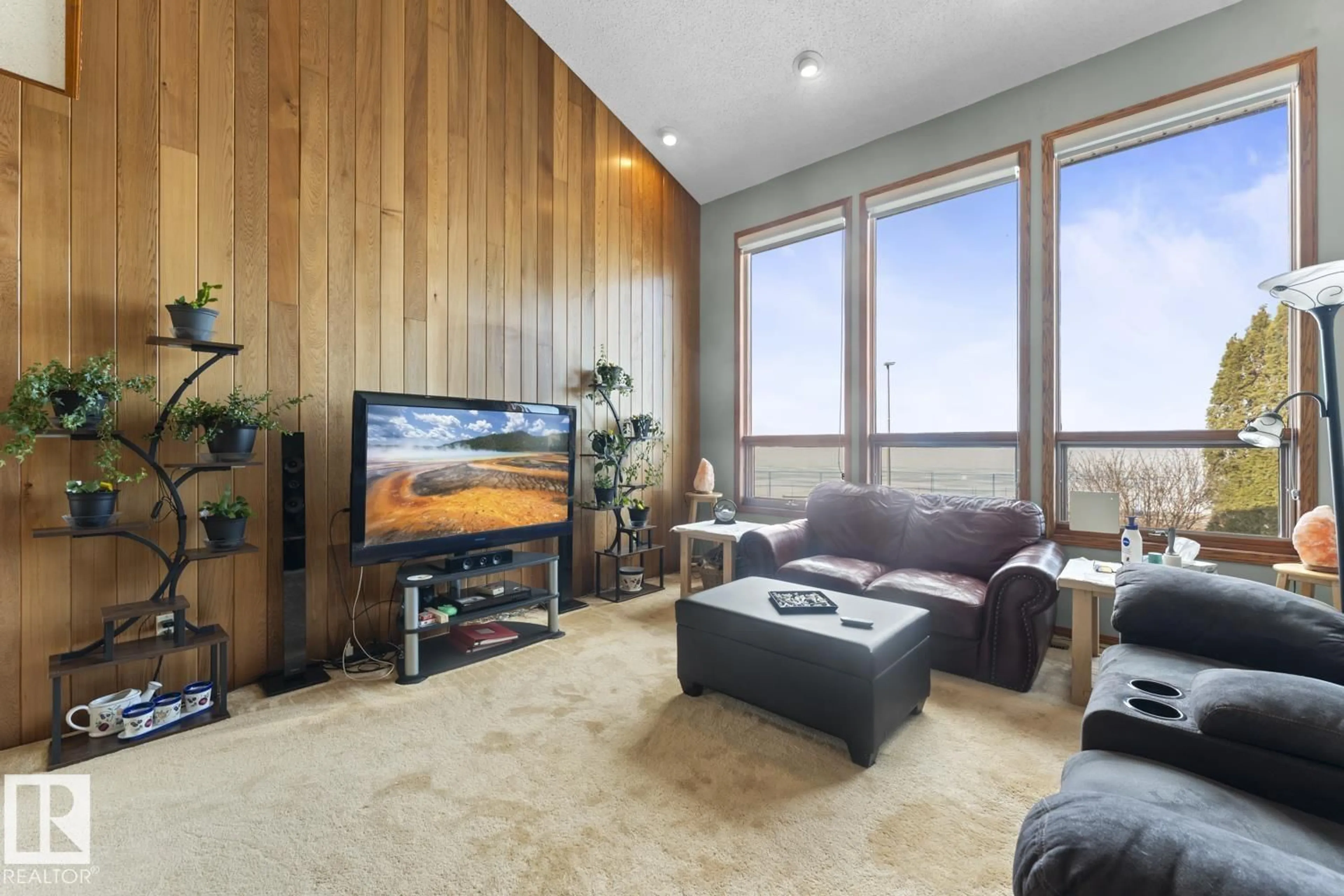 Living room with furniture, wood/laminate floor for 311 LAKESHORE DR, Cold Lake Alberta T9M1A3