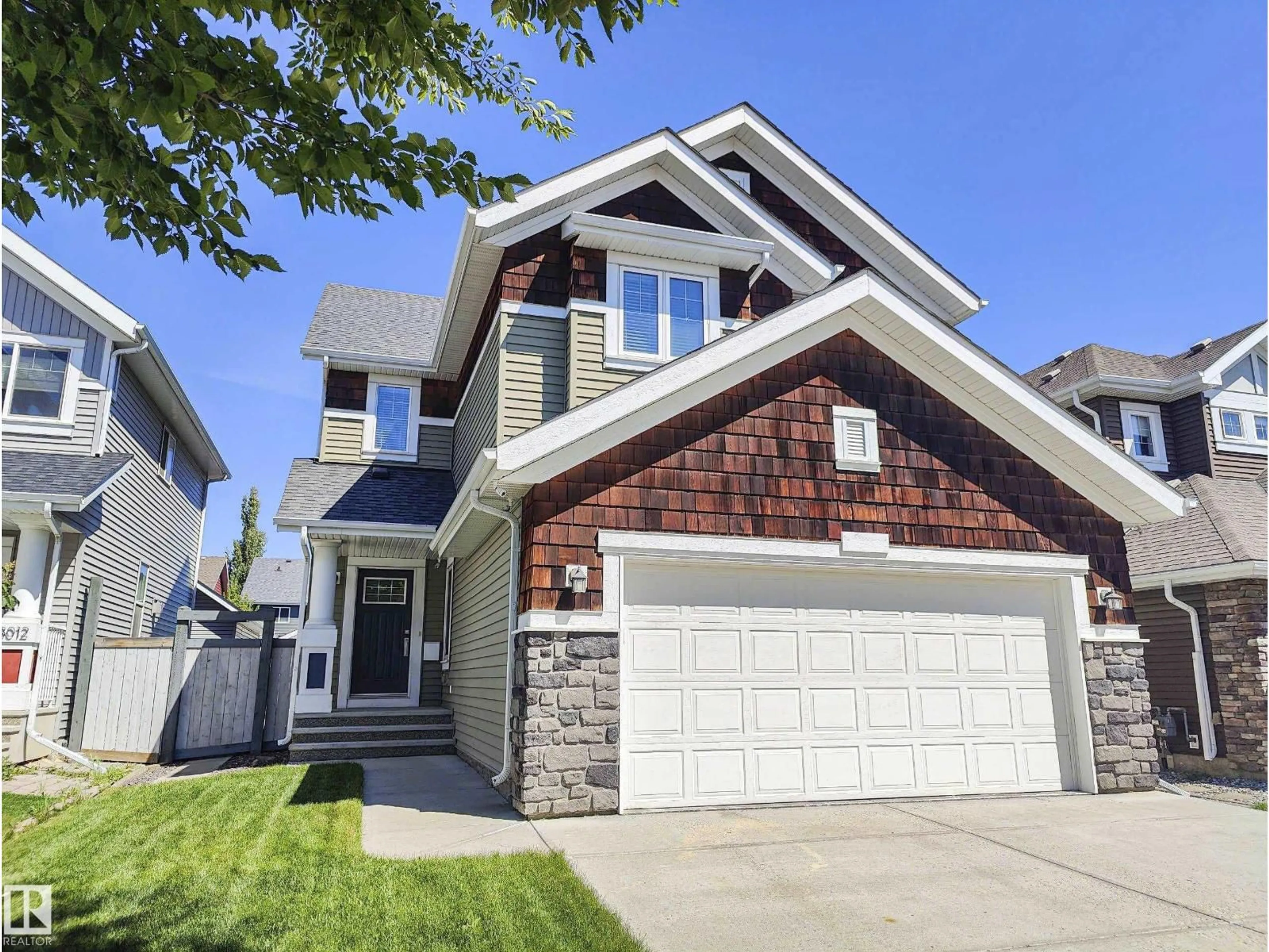 Home with vinyl exterior material, street for 8008 18 AV SW, Edmonton Alberta T6X0Z8