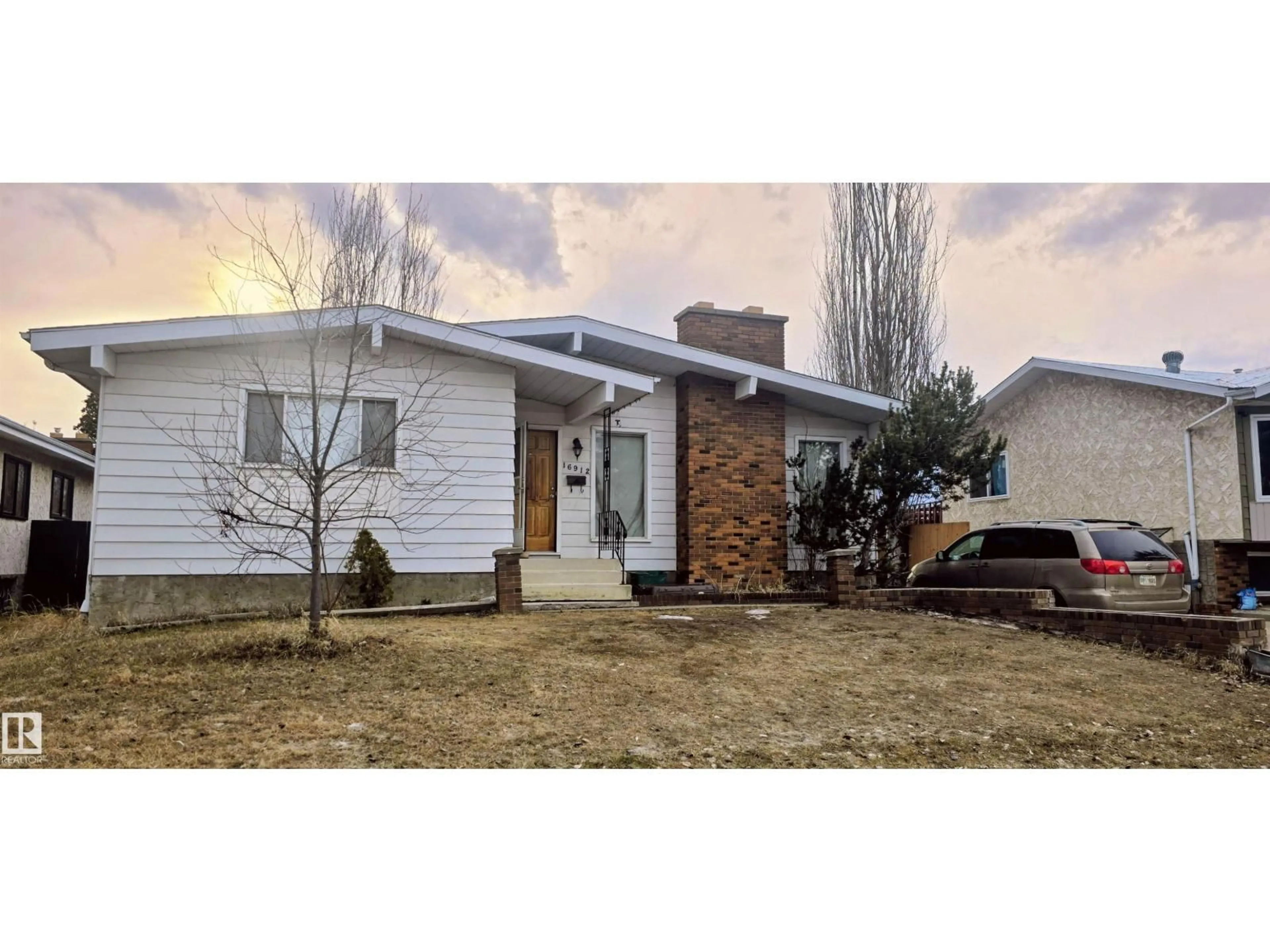 Home with vinyl exterior material, street for NW - 16912 110 ST, Edmonton Alberta T5X2N8