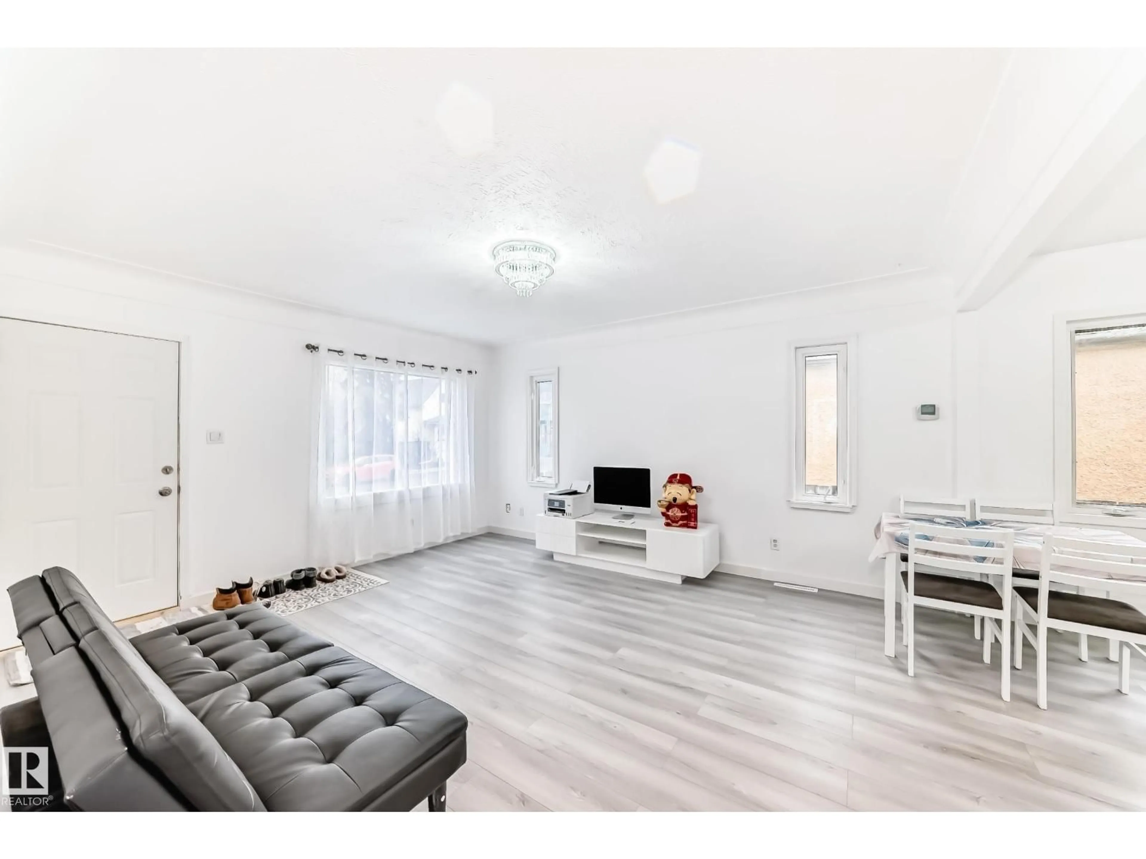 Living room with furniture, unknown for 9221 110 AV, Edmonton Alberta T5H1H2