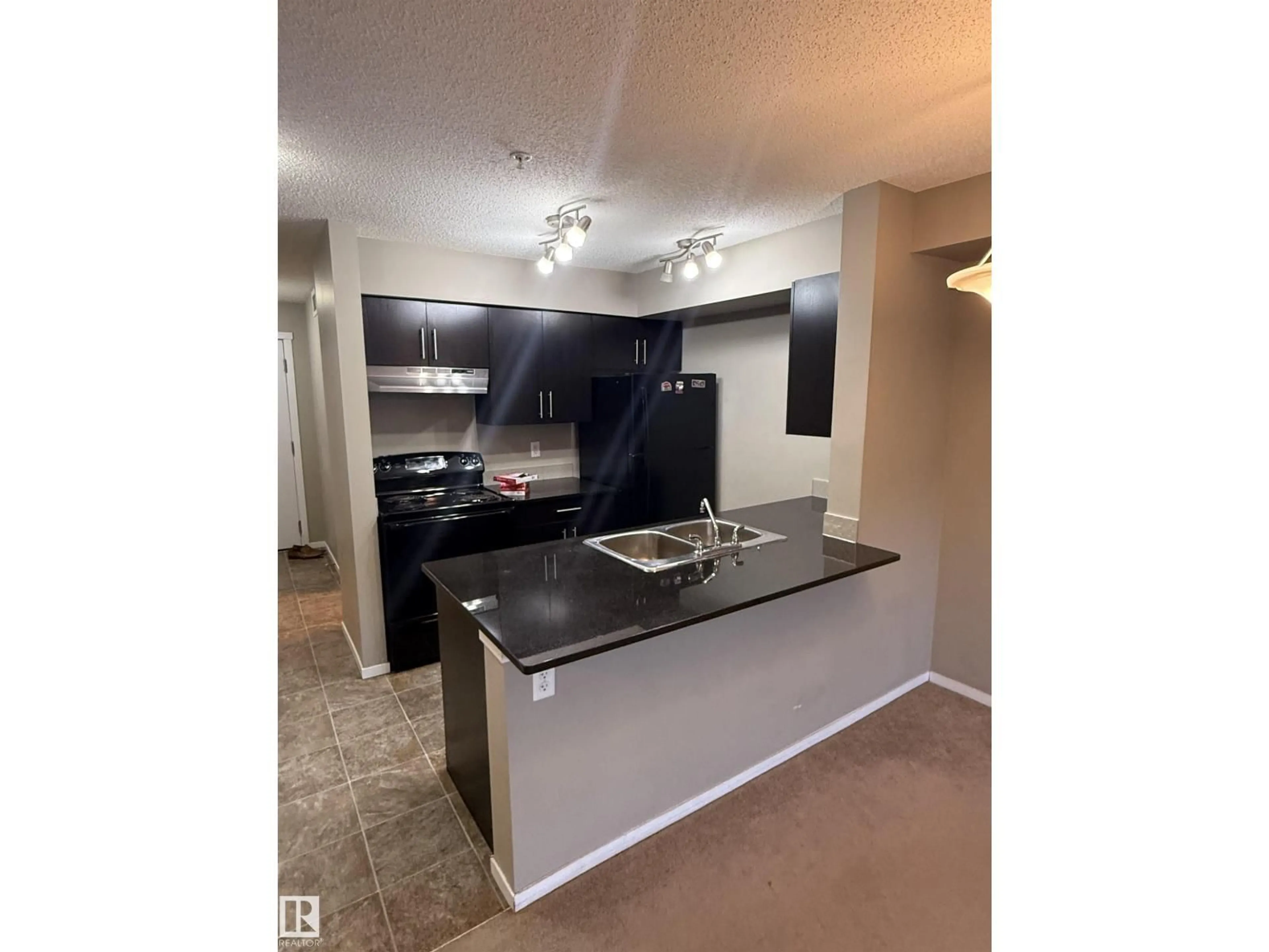 Open concept kitchen, unknown for #104 - 3207 JAMES MOWATT TR, Edmonton Alberta T6W3L6