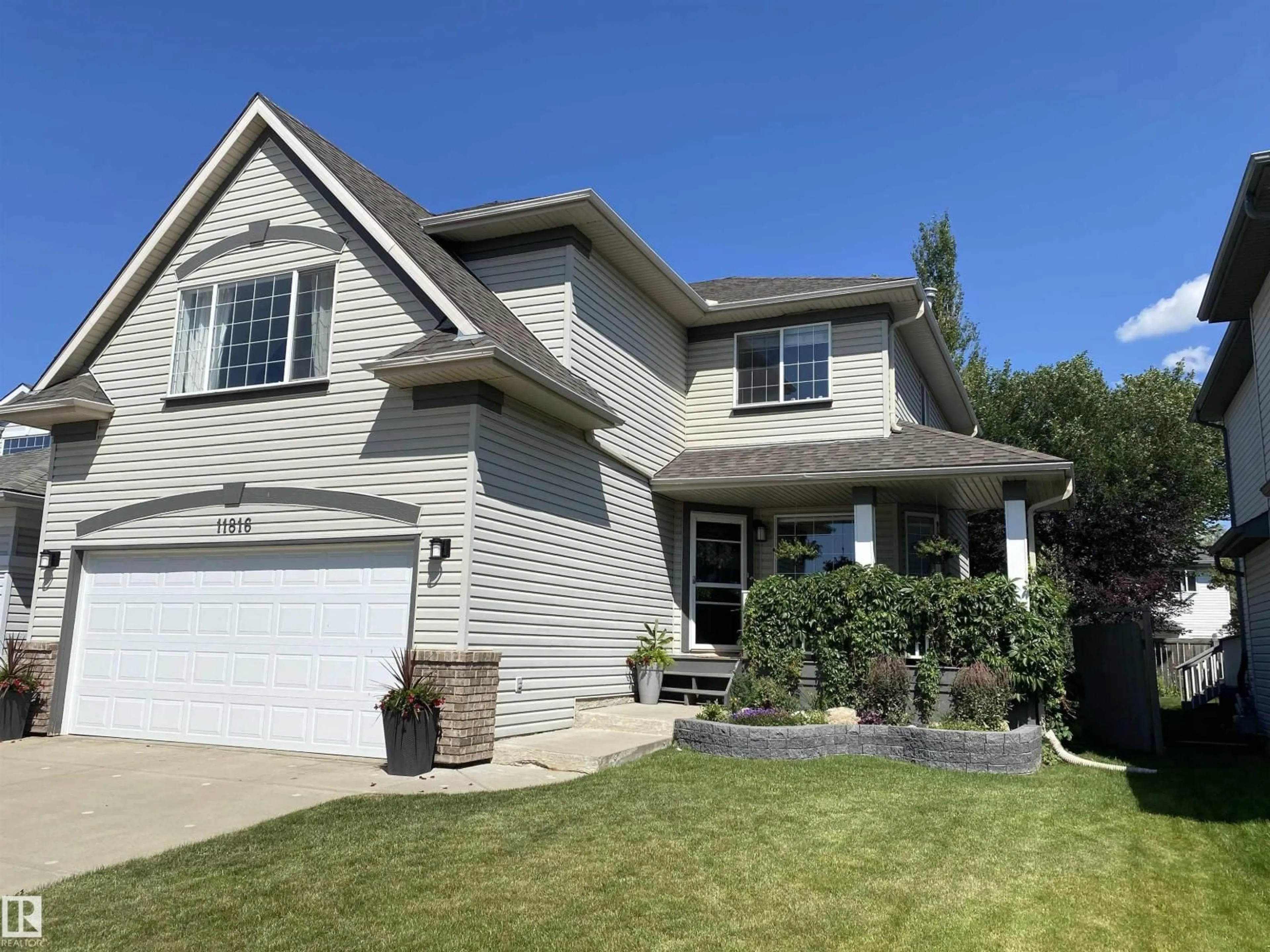 Home with vinyl exterior material, street for 11816 13 AV, Edmonton Alberta T6J7E9