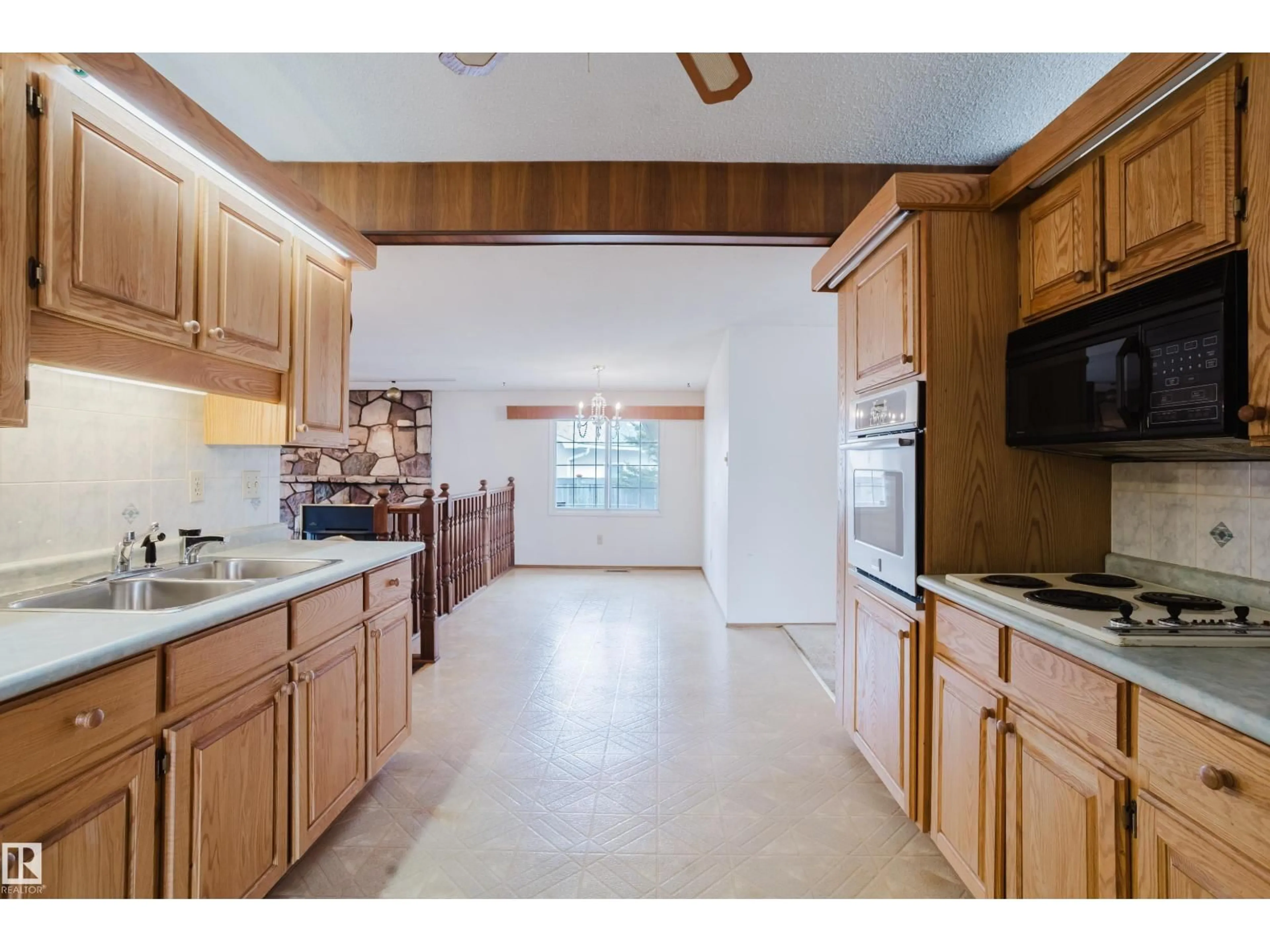 Open concept kitchen, ceramic/tile floor for 9536 151 AV, Edmonton Alberta T5E2R3