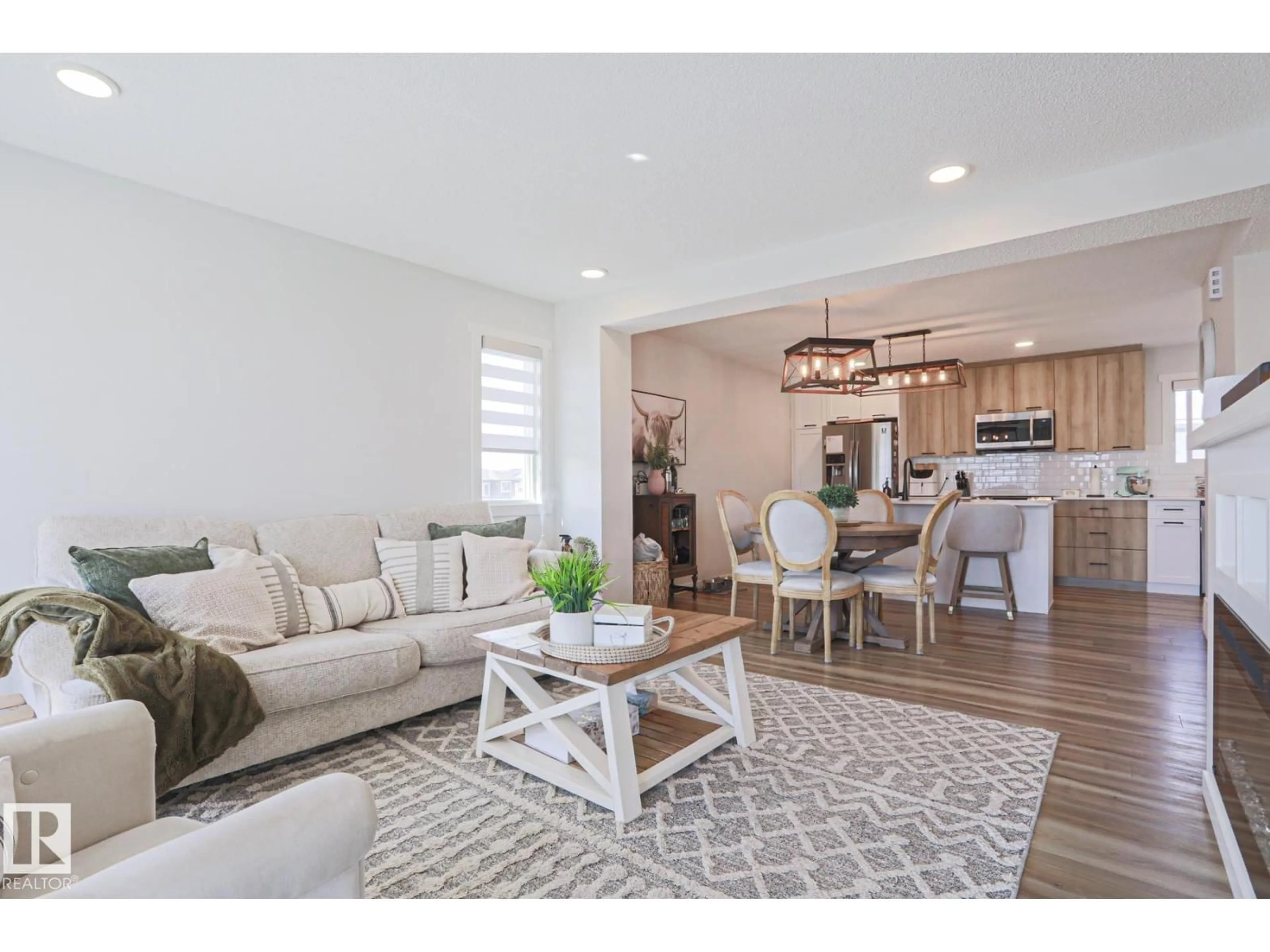 Living room with furniture, wood/laminate floor for 1274 ASTER BV, Edmonton Alberta T6T2N8