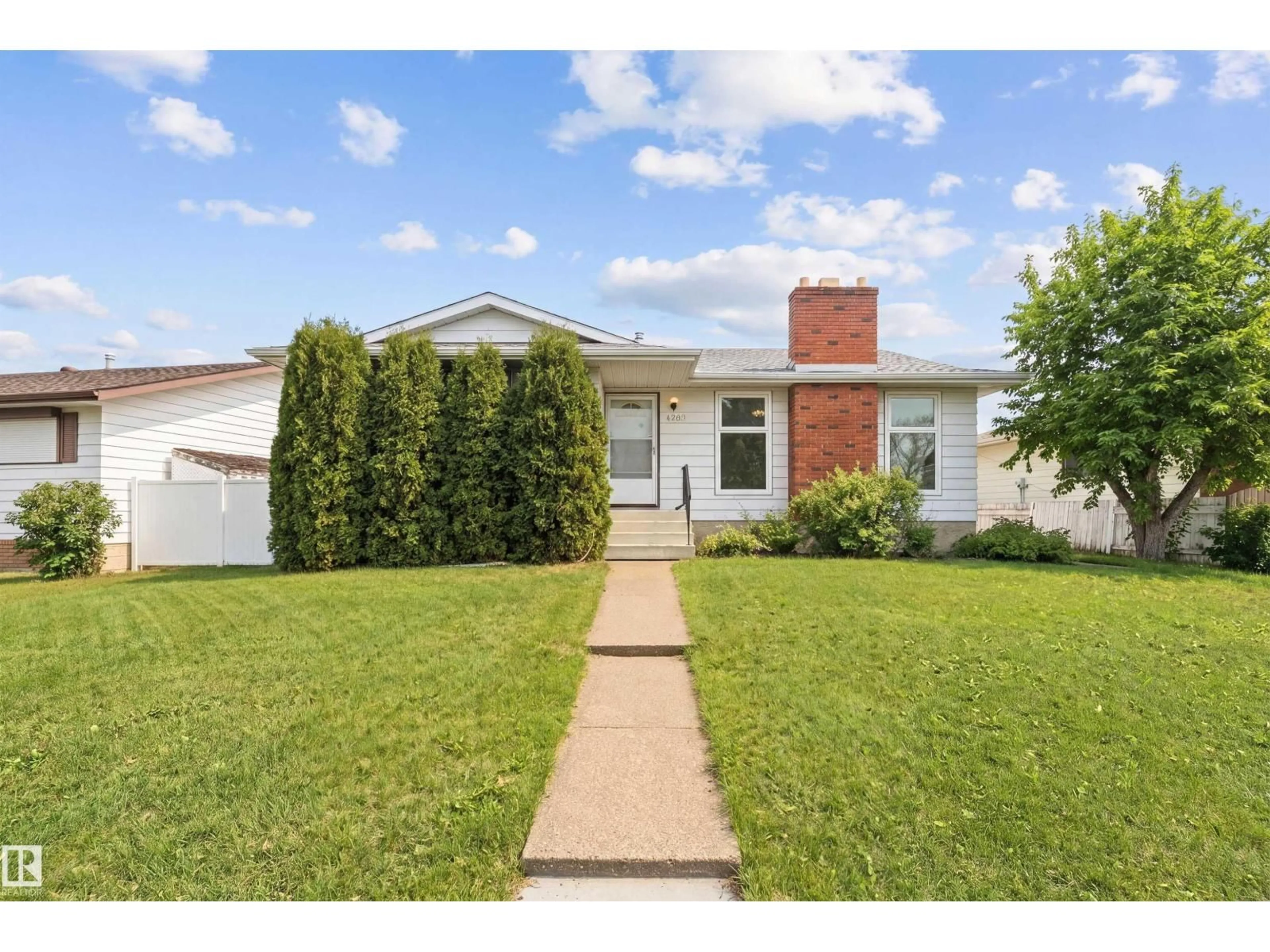 Home with vinyl exterior material, street for 1707 65 ST, Edmonton Alberta T6L1N1