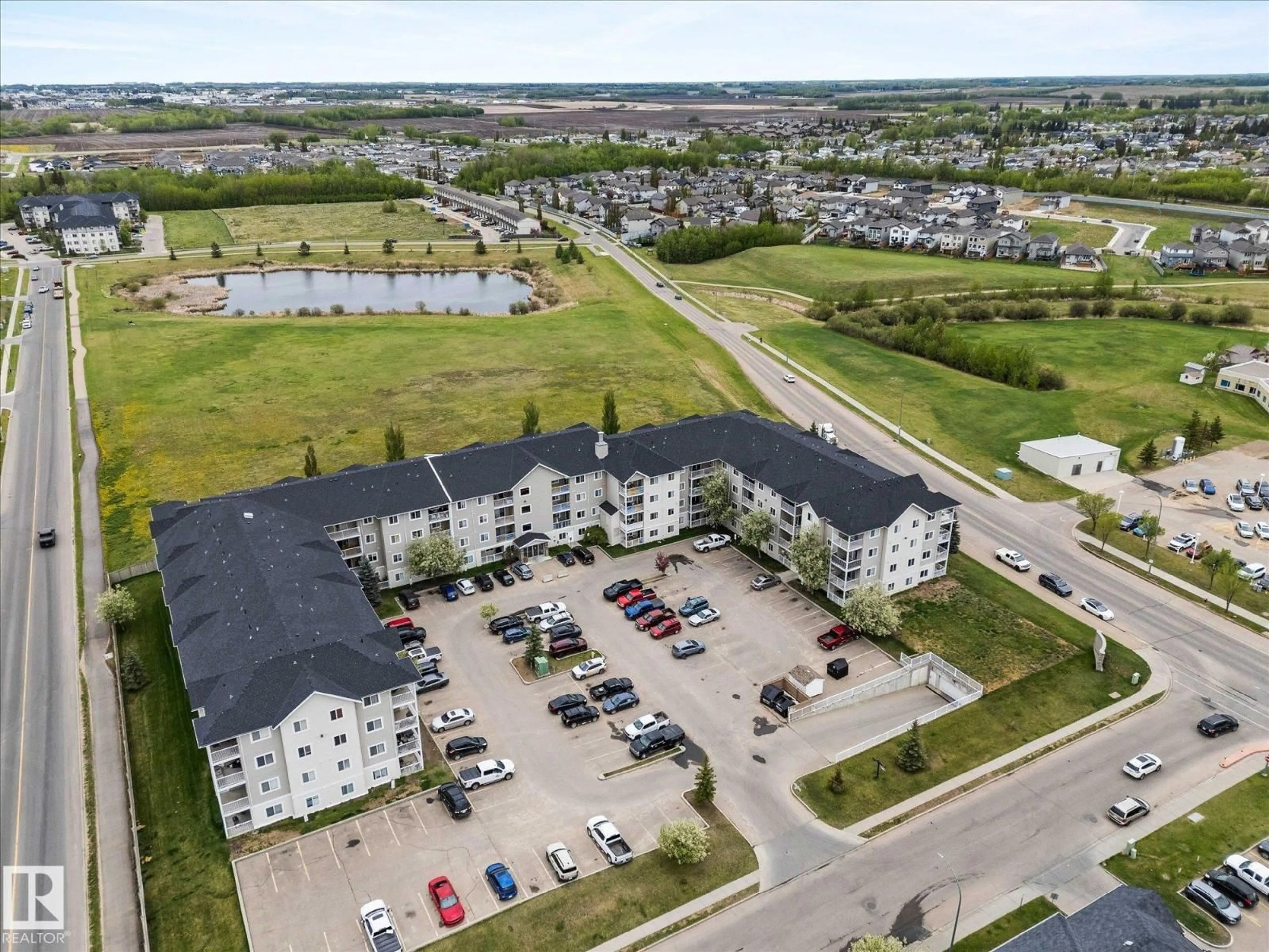A pic from outside/outdoor area/front of a property/back of a property/a pic from drone, water/lake/river/ocean view for #327 - 4309 33 ST, Stony Plain Alberta T7Z0C4