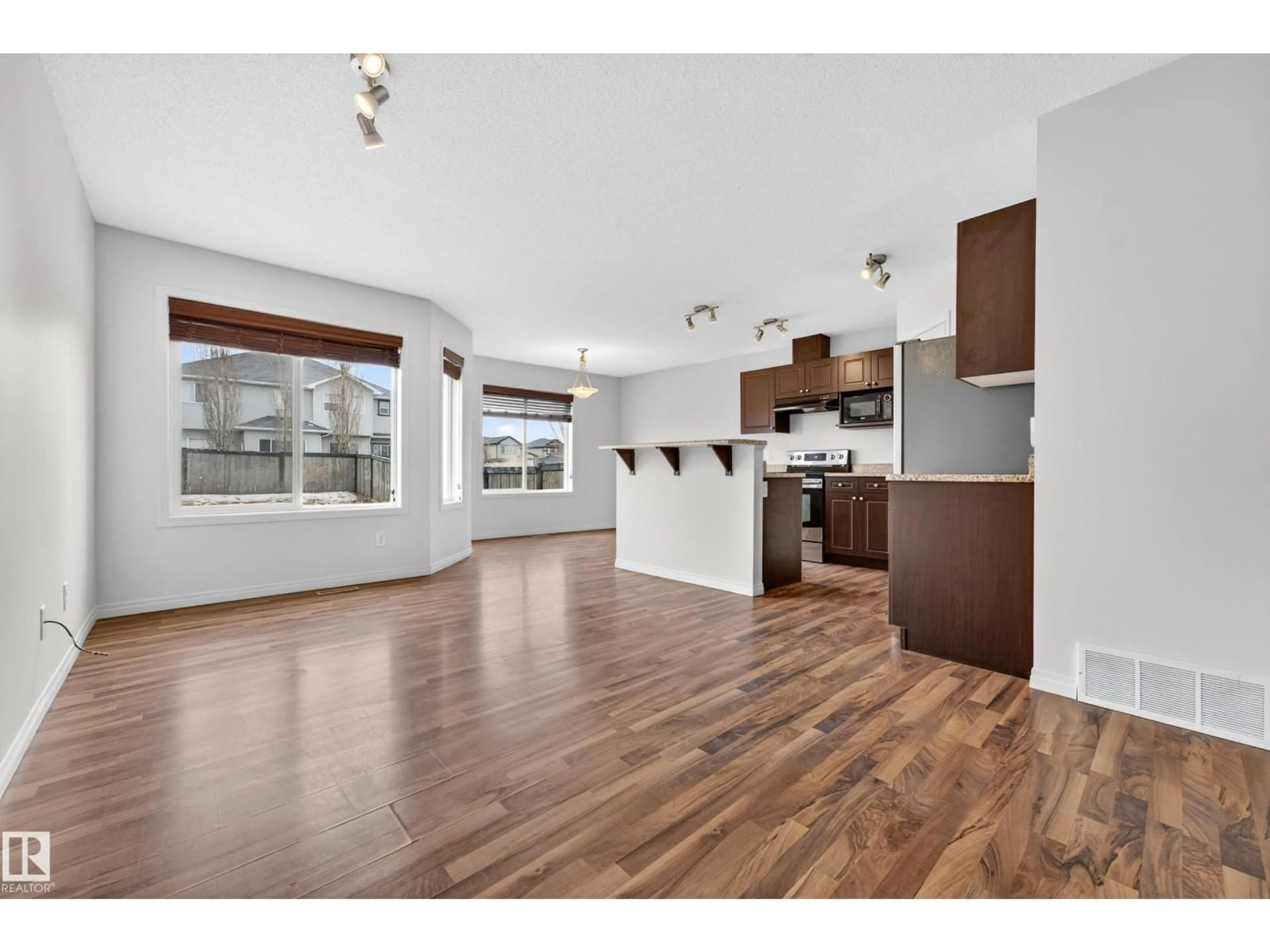 Open concept kitchen, wood/laminate floor for 3 CARAGANA WY, Fort Saskatchewan Alberta T8L0H8
