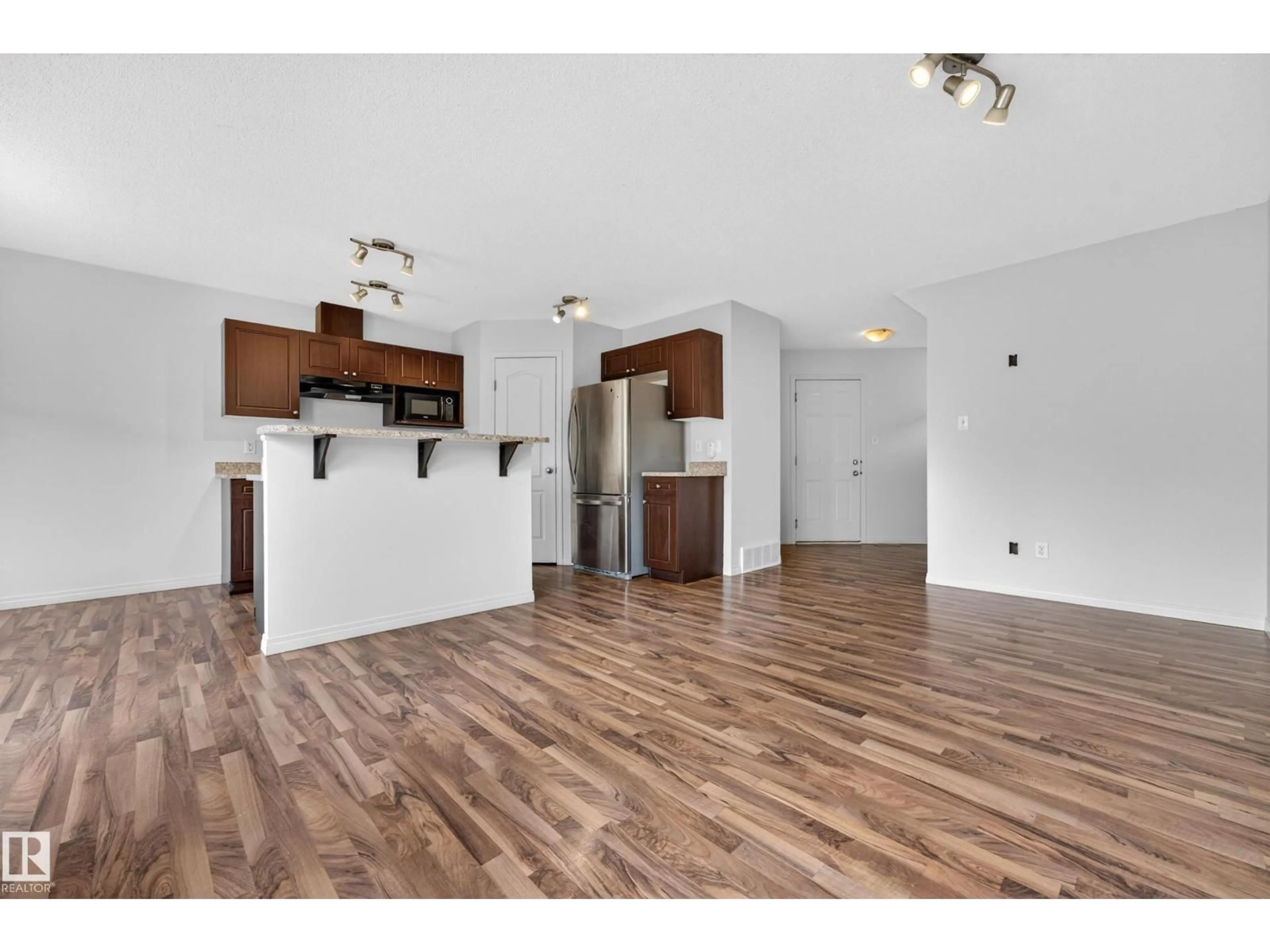 Open concept kitchen, wood/laminate floor for 3 CARAGANA WY, Fort Saskatchewan Alberta T8L0H8