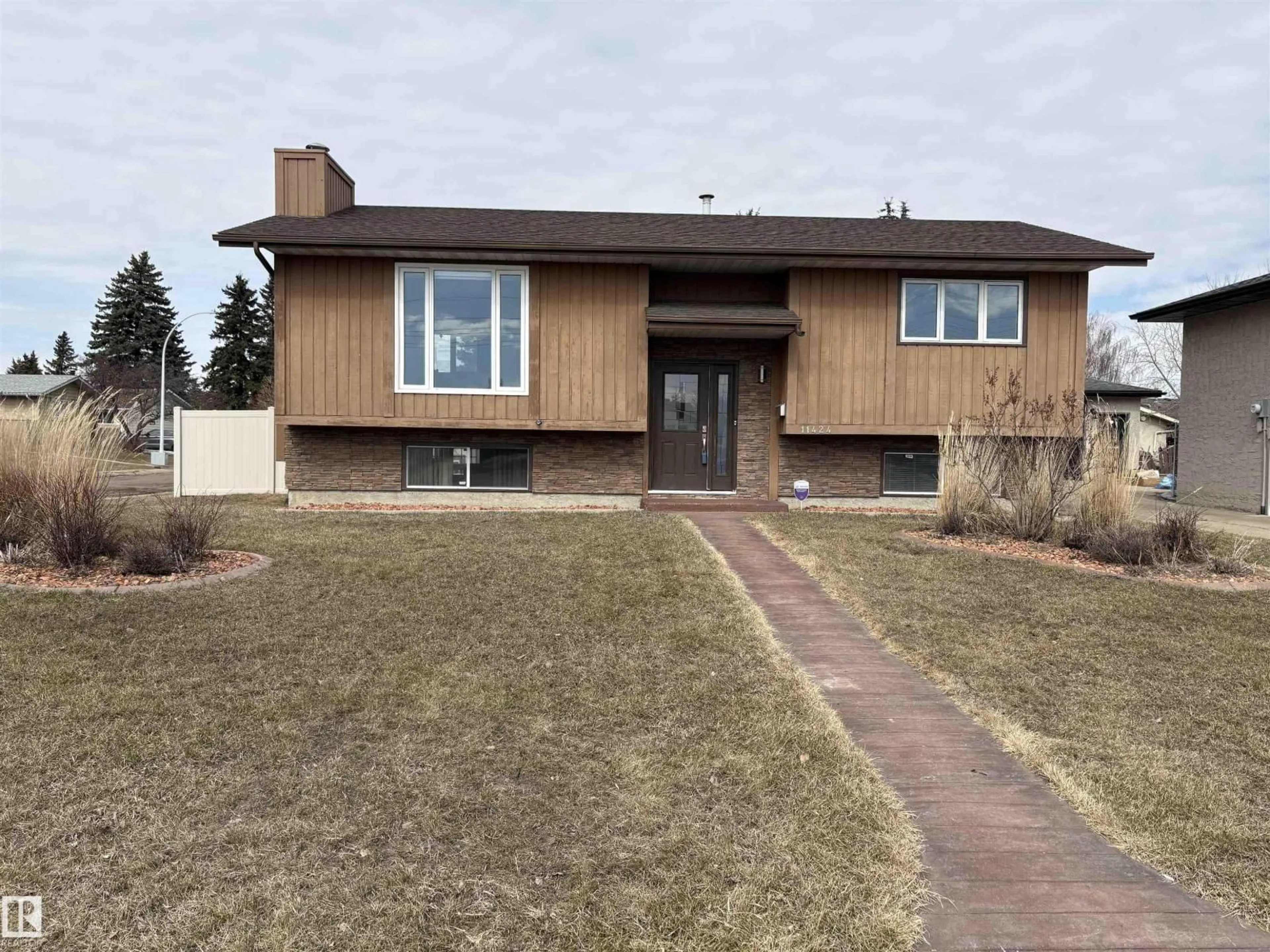Home with vinyl exterior material, street for 11424 164 AV, Edmonton Alberta T5X3W2