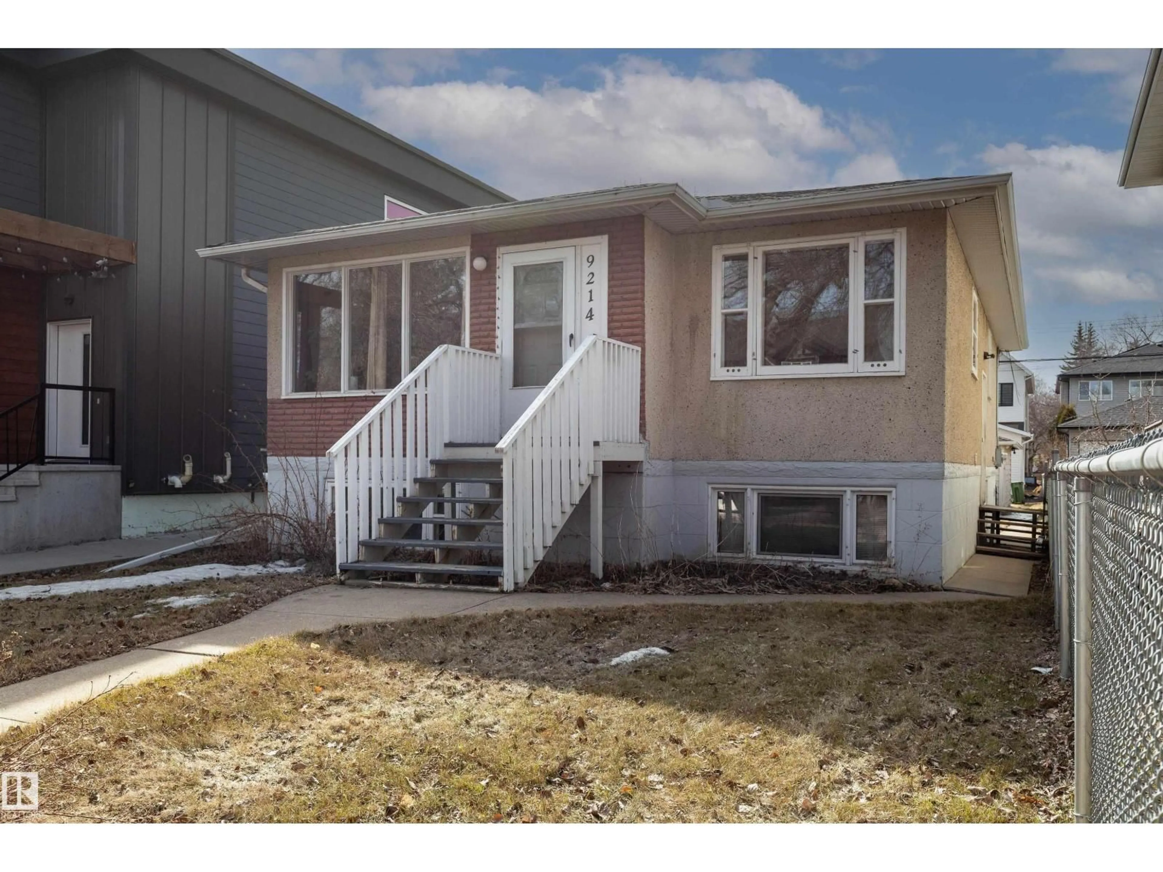 Home with vinyl exterior material, street for NW - 9214 92 ST, Edmonton Alberta T6C3R5