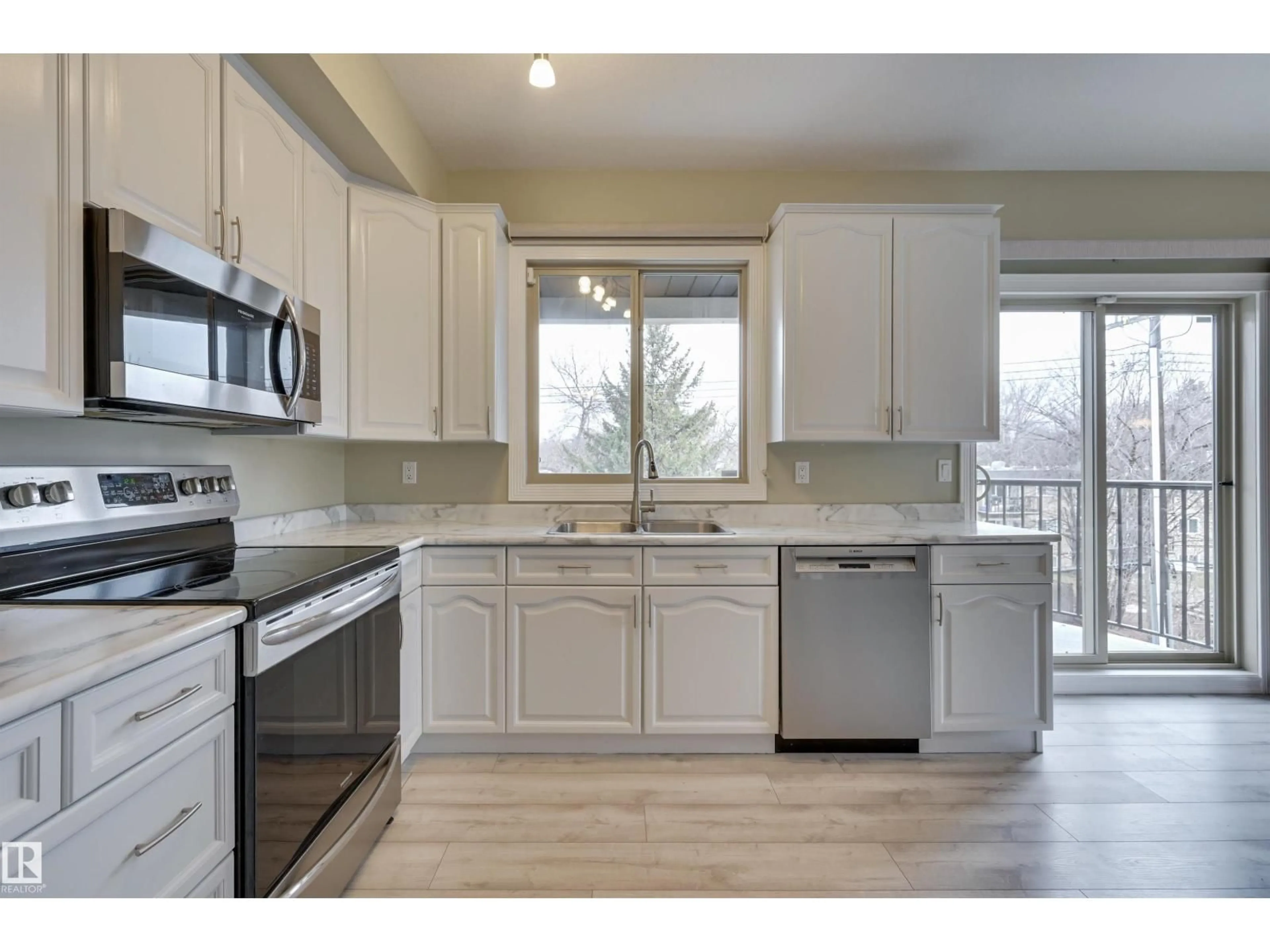 Open concept kitchen, wood/laminate floor for #302 - 10630 78 AV, Edmonton Alberta T6E1P5
