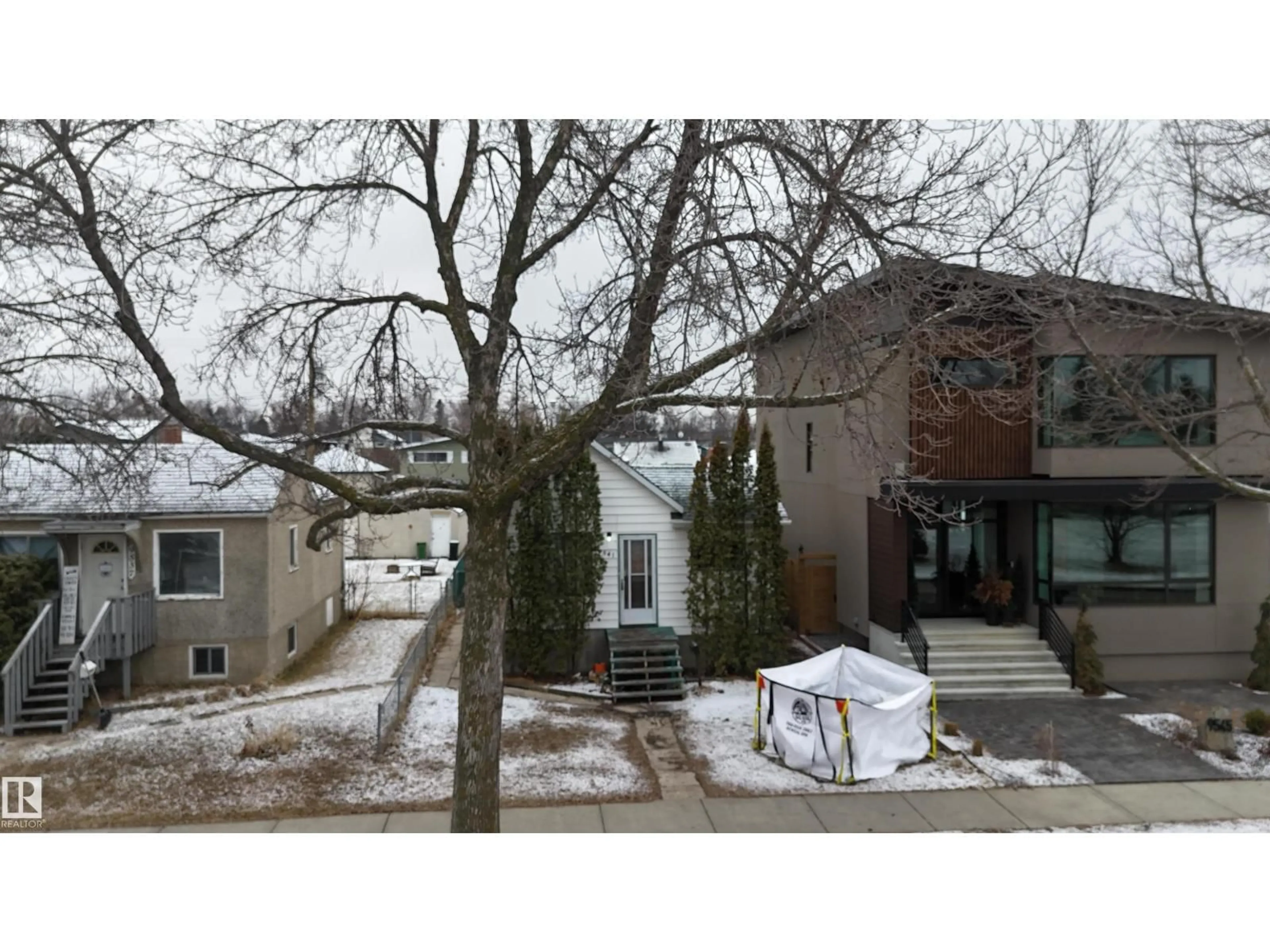 A pic from outside/outdoor area/front of a property/back of a property/a pic from drone, street for 9541 77 AV, Edmonton Alberta T6C2M5