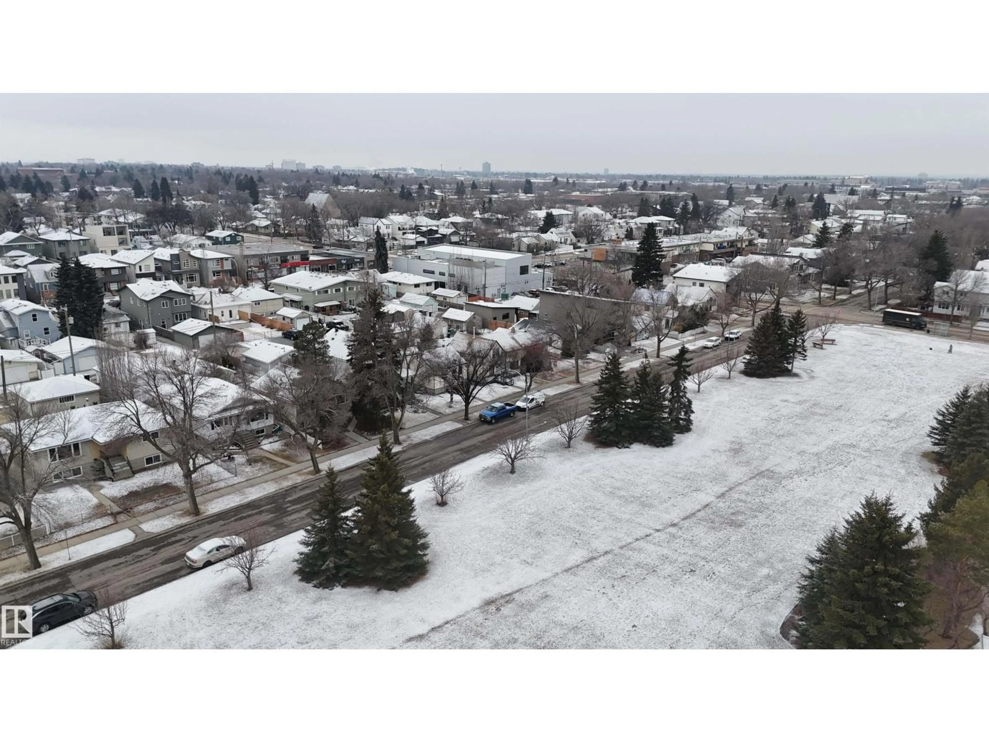 A pic from outside/outdoor area/front of a property/back of a property/a pic from drone, street for 9541 77 AV, Edmonton Alberta T6C2M5