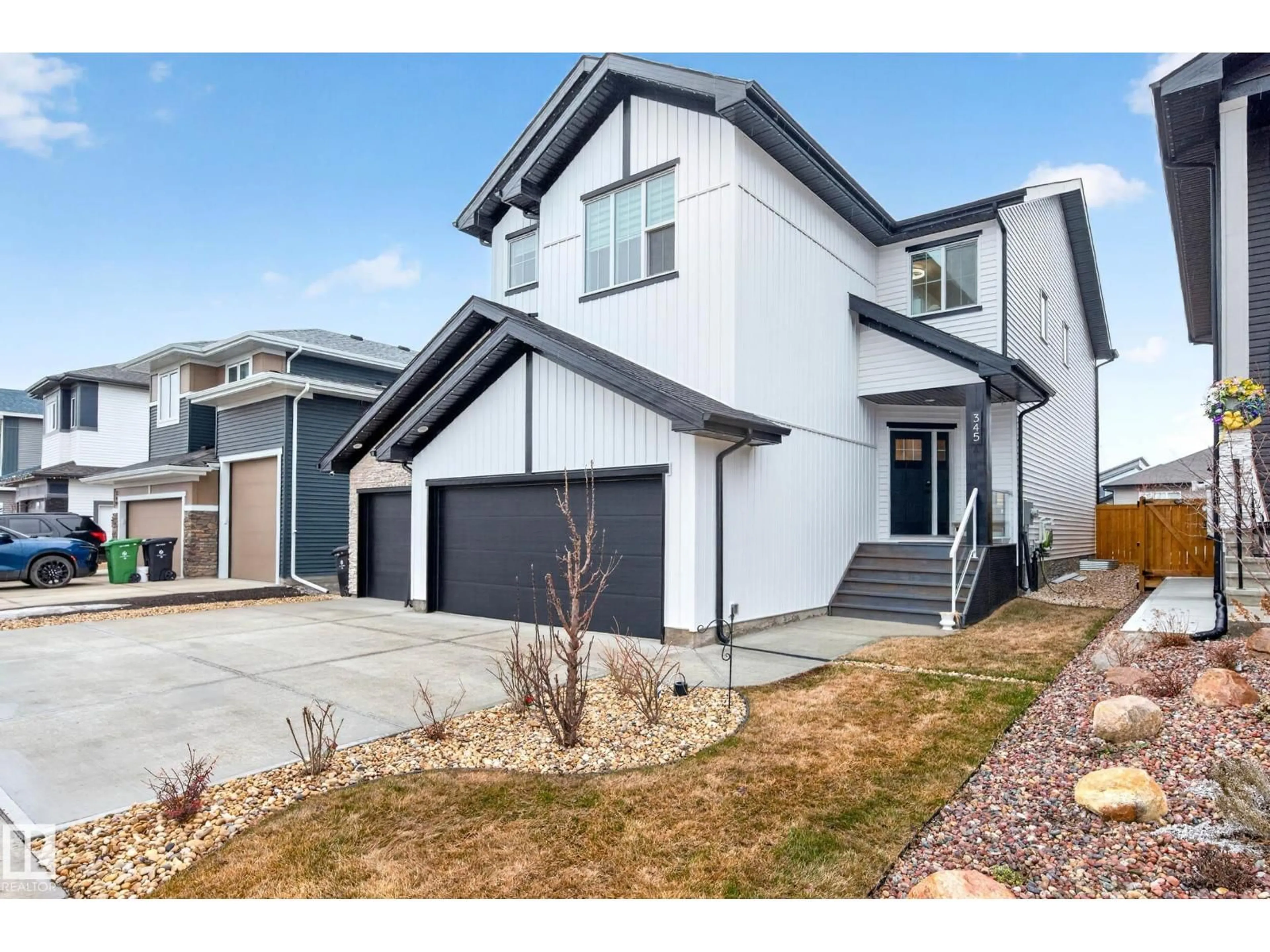 Home with vinyl exterior material, street for 345 MEADOWVIEW DR, Fort Saskatchewan Alberta T8L0Y4