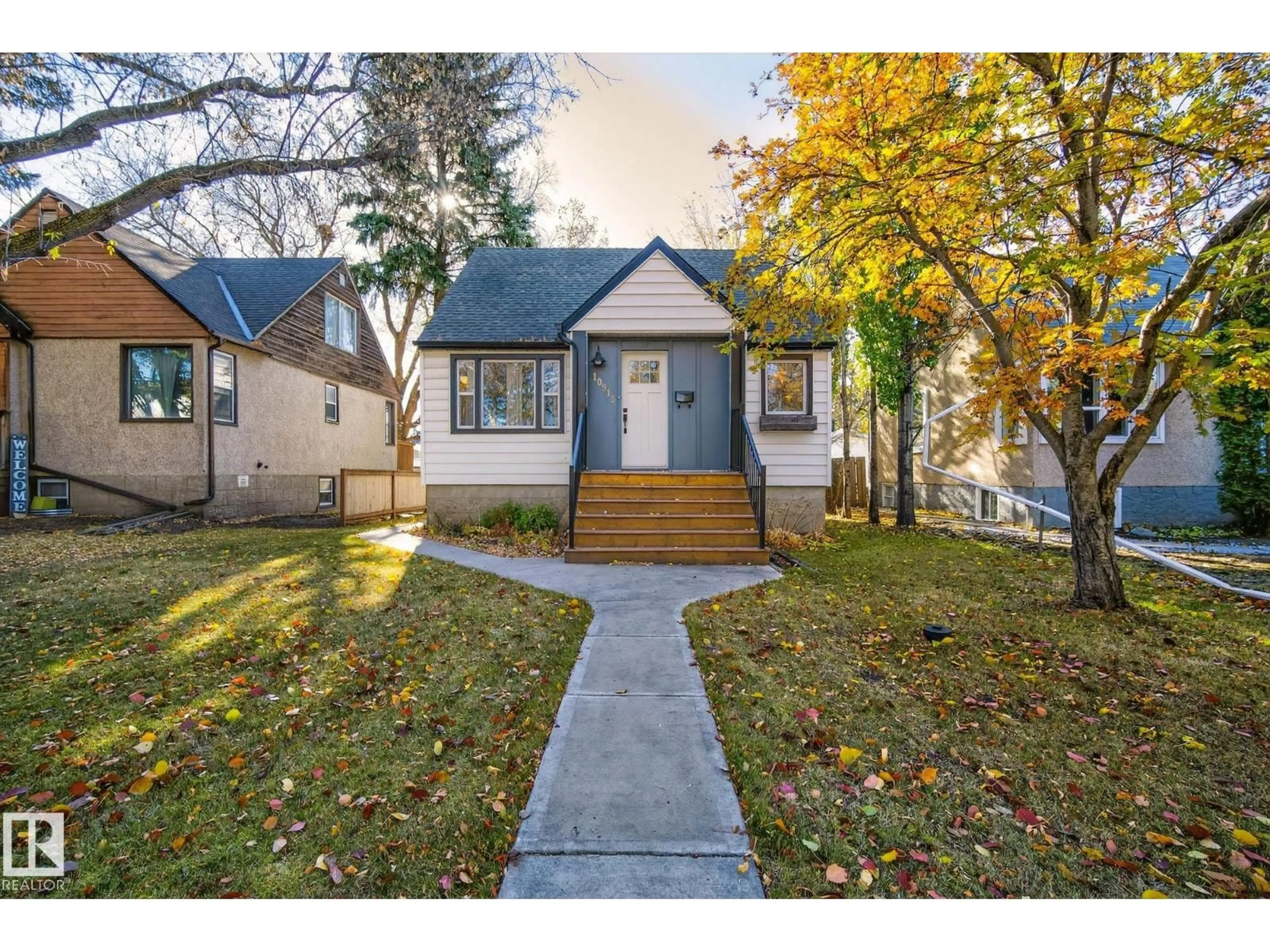 Home with vinyl exterior material, street for 10915 67 AV, Edmonton Alberta T6H2A5