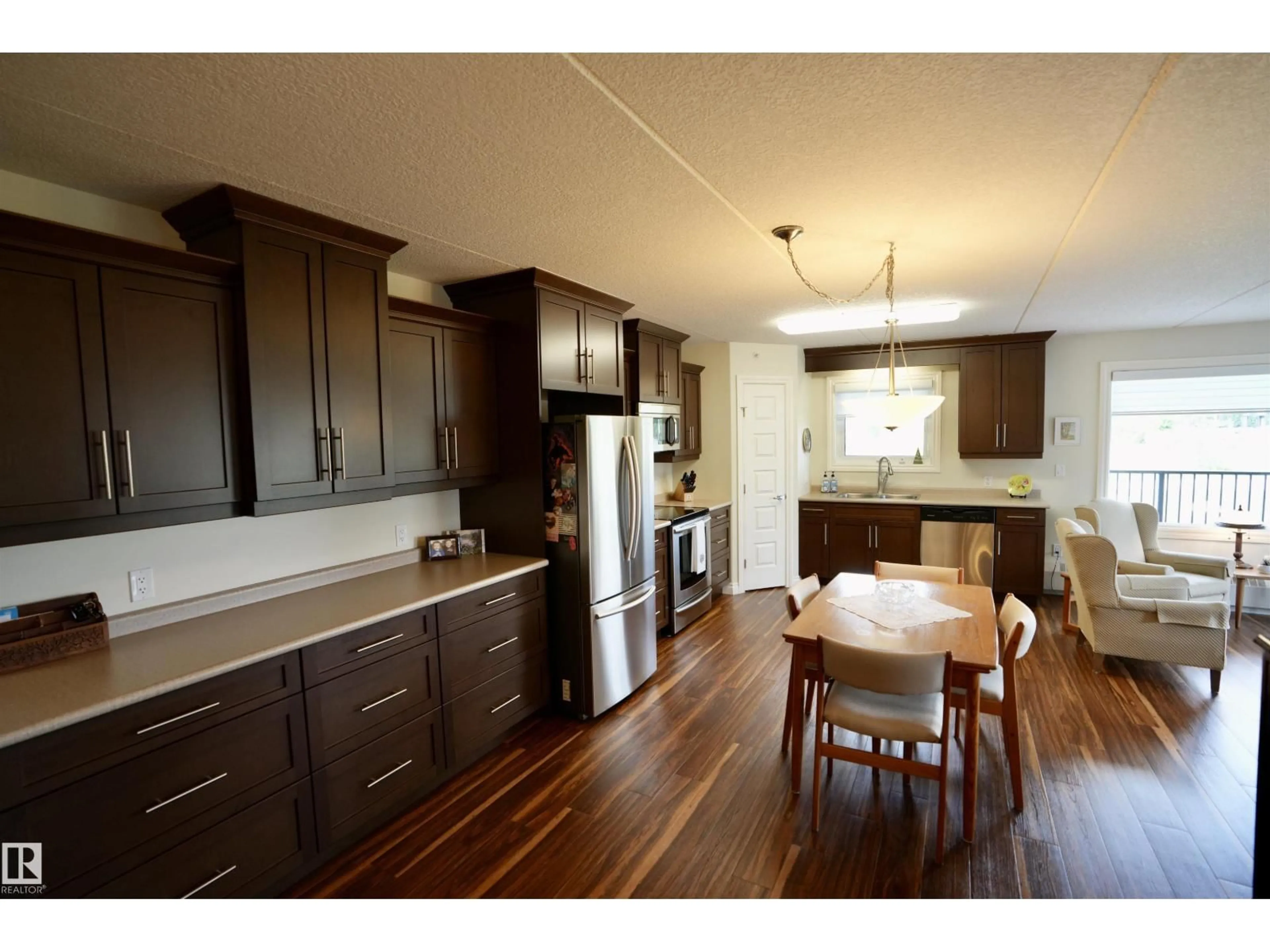 Open concept kitchen, wood/laminate floor for 204 - 4614A LAKESHORE DRIVE, St. Paul Town Alberta T0A3A3
