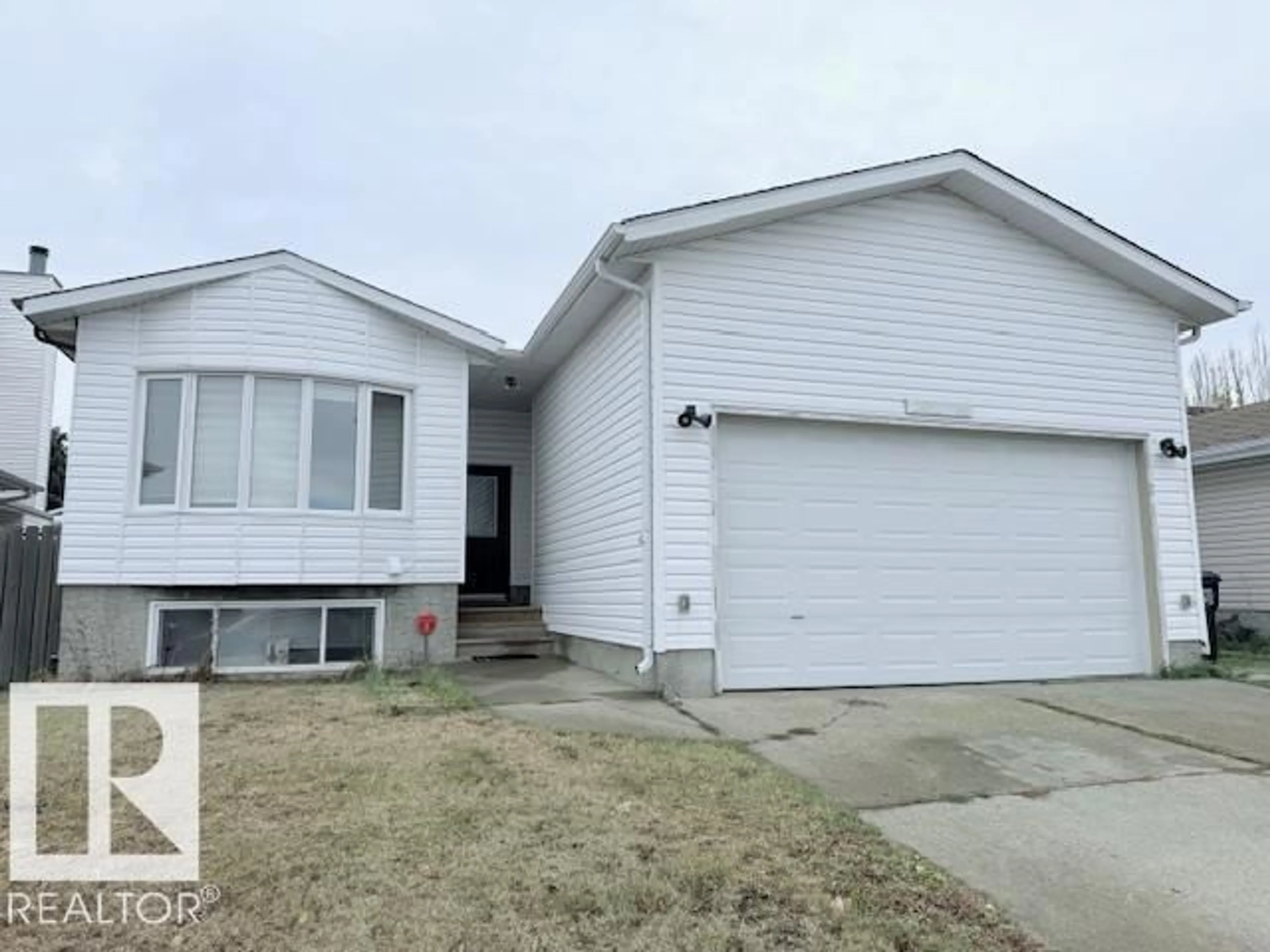 Home with vinyl exterior material, street for 2831 36 ST, Edmonton Alberta T6L3Y6