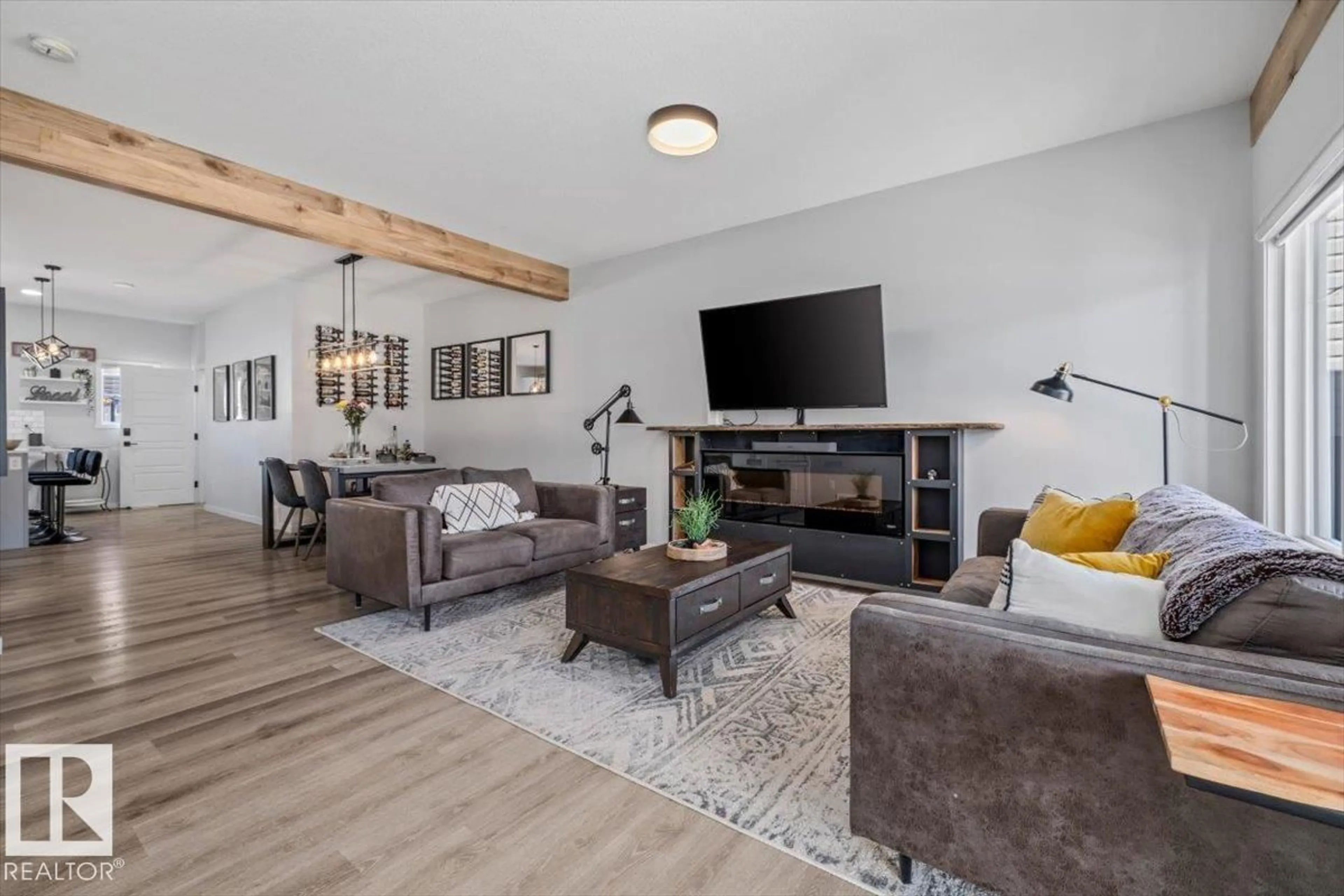 Living room with furniture, wood/laminate floor for NW - 17948 62 ST, Edmonton Alberta T5Y4A6