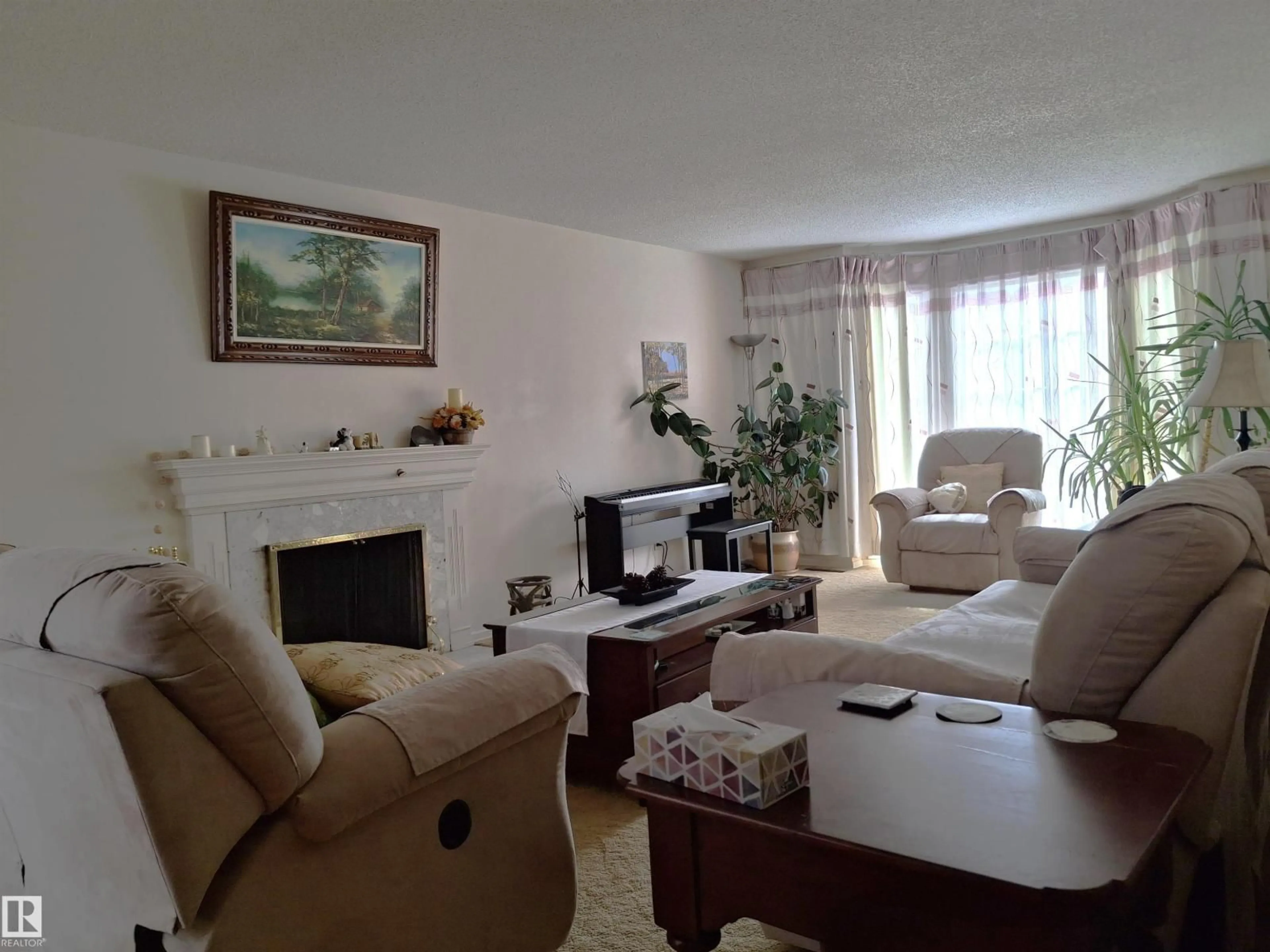 Living room with furniture, unknown for 13112 63 AV, Edmonton Alberta T6H1S2