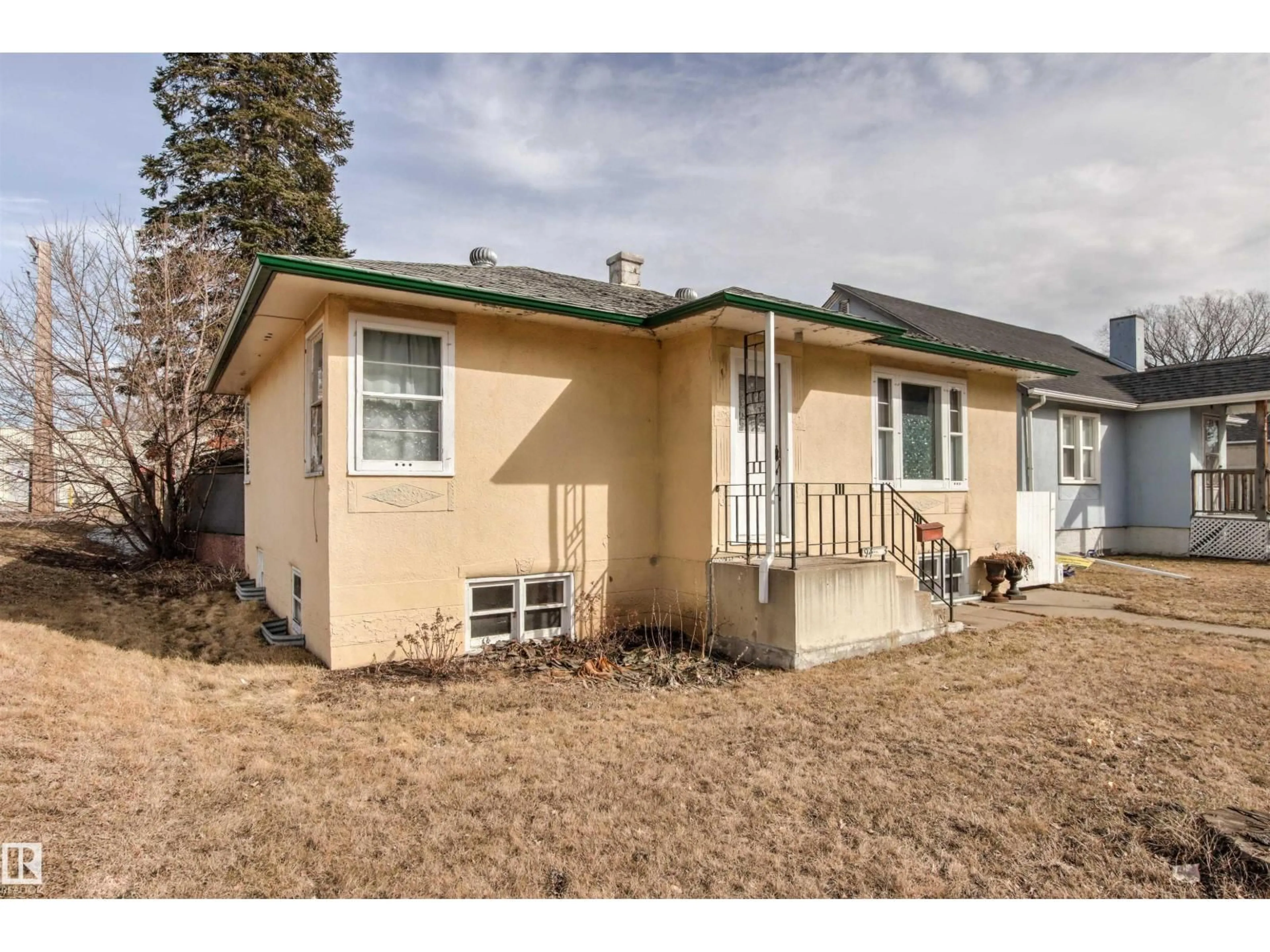 Home with vinyl exterior material, street for NW - 9423 92 ST, Edmonton Alberta T6E2E6