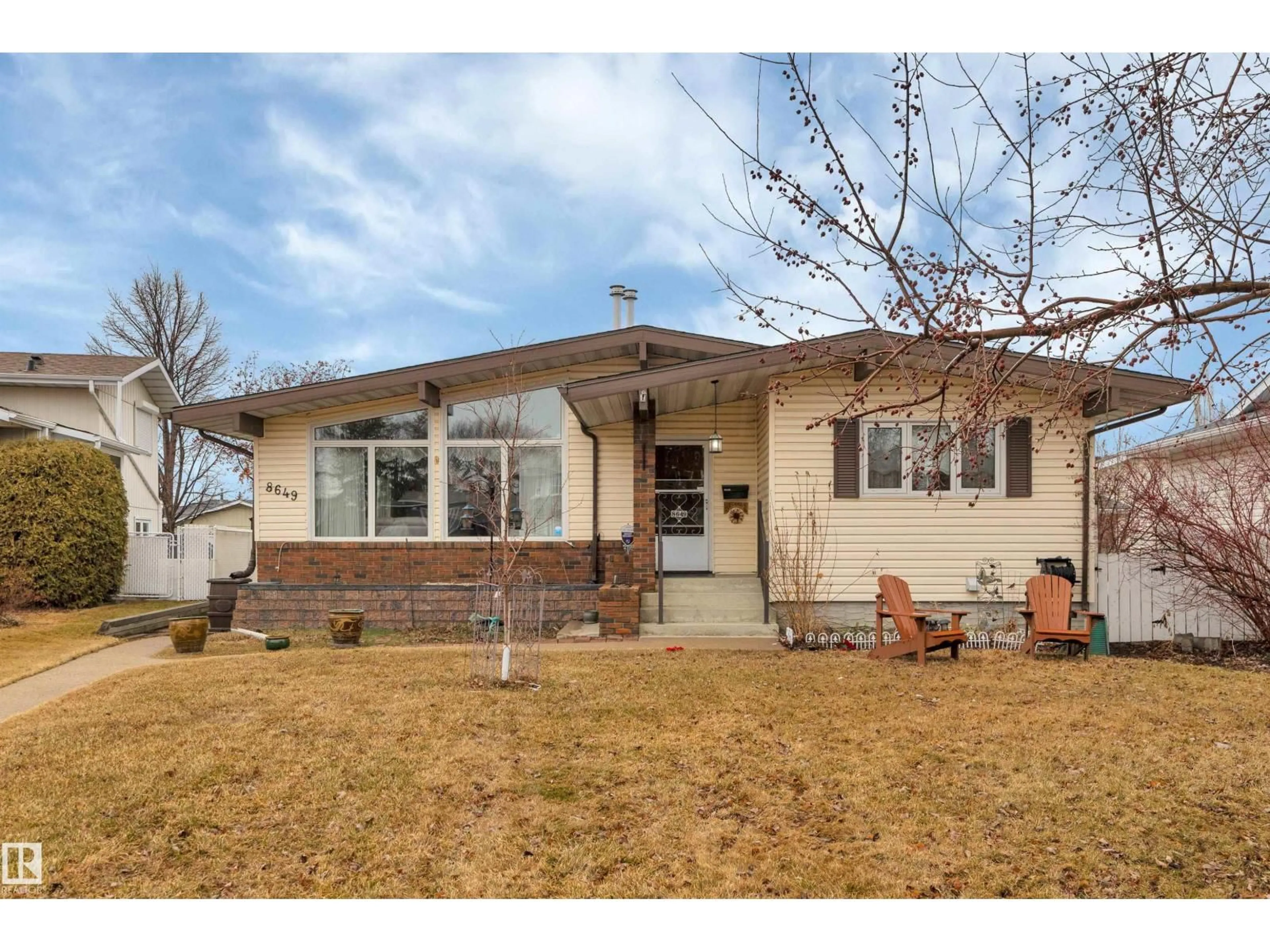 Home with brick exterior material, street for 8649 27 AV, Edmonton Alberta T6K2X3