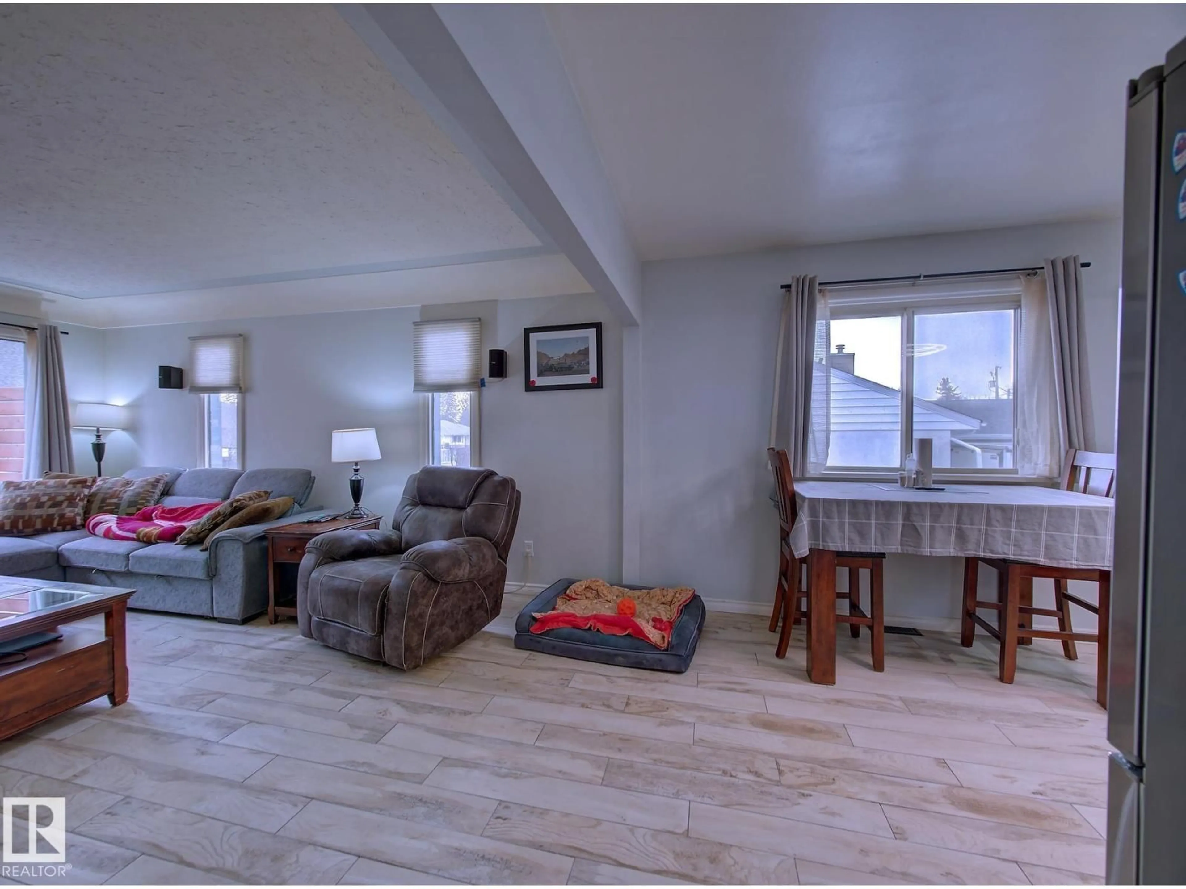 Living room with furniture, wood/laminate floor for 12 ROSS DR, Fort Saskatchewan Alberta T8L2M8