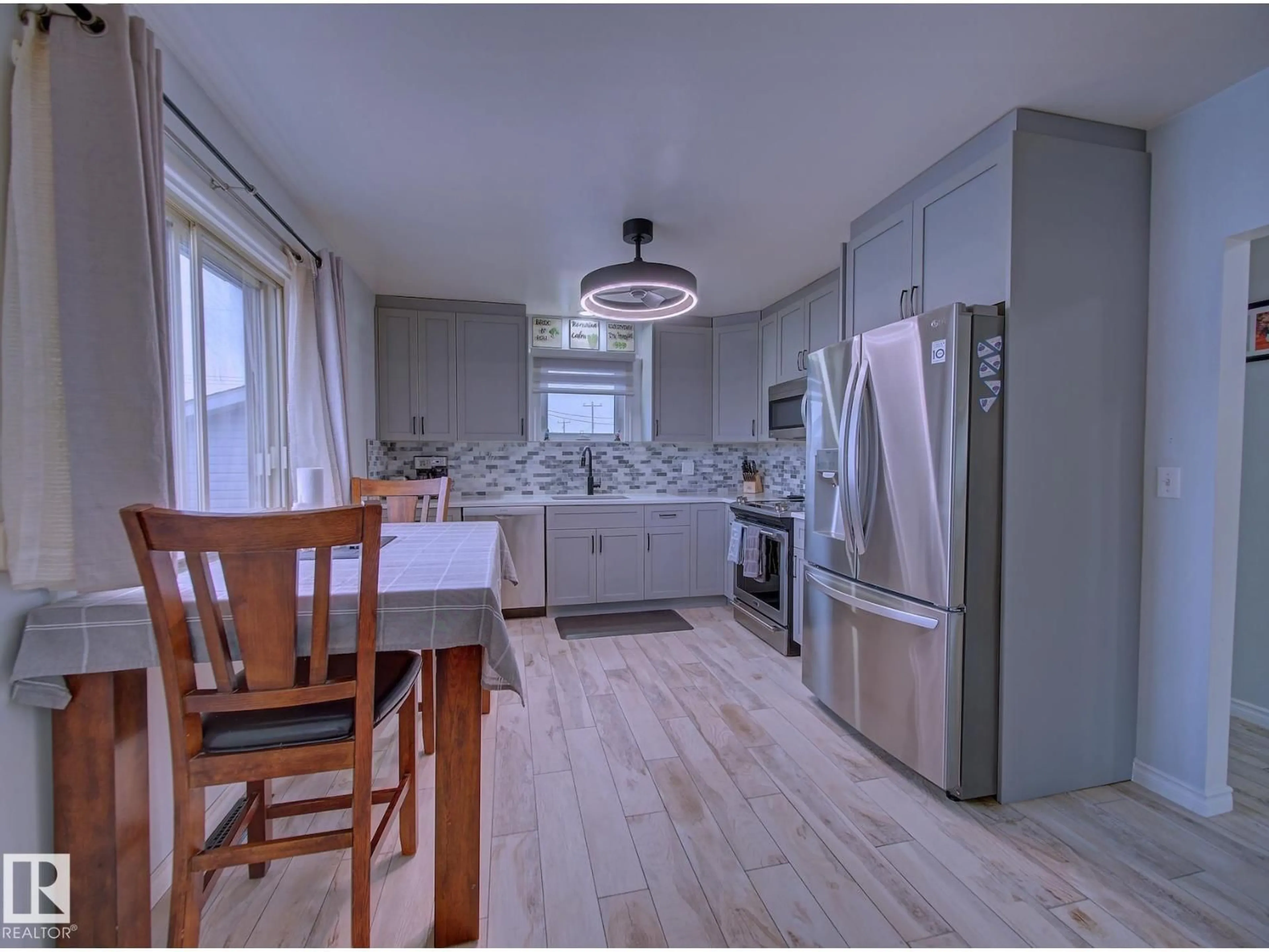 Open concept kitchen, wood/laminate floor for 12 ROSS DR, Fort Saskatchewan Alberta T8L2M8
