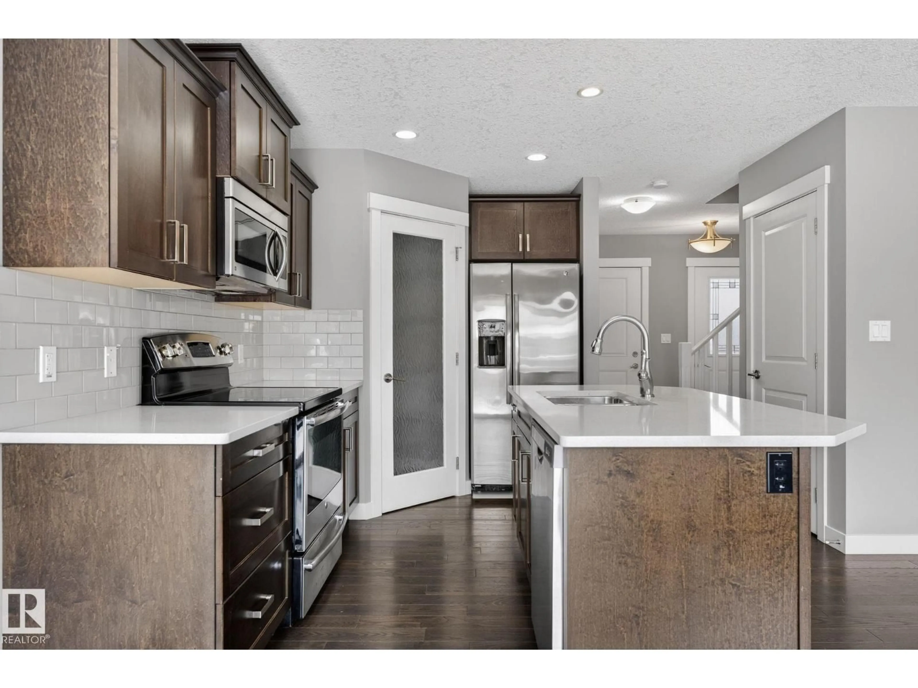 Open concept kitchen, unknown for 33 ROSEBERRY LN, Fort Saskatchewan Alberta T8L0M6