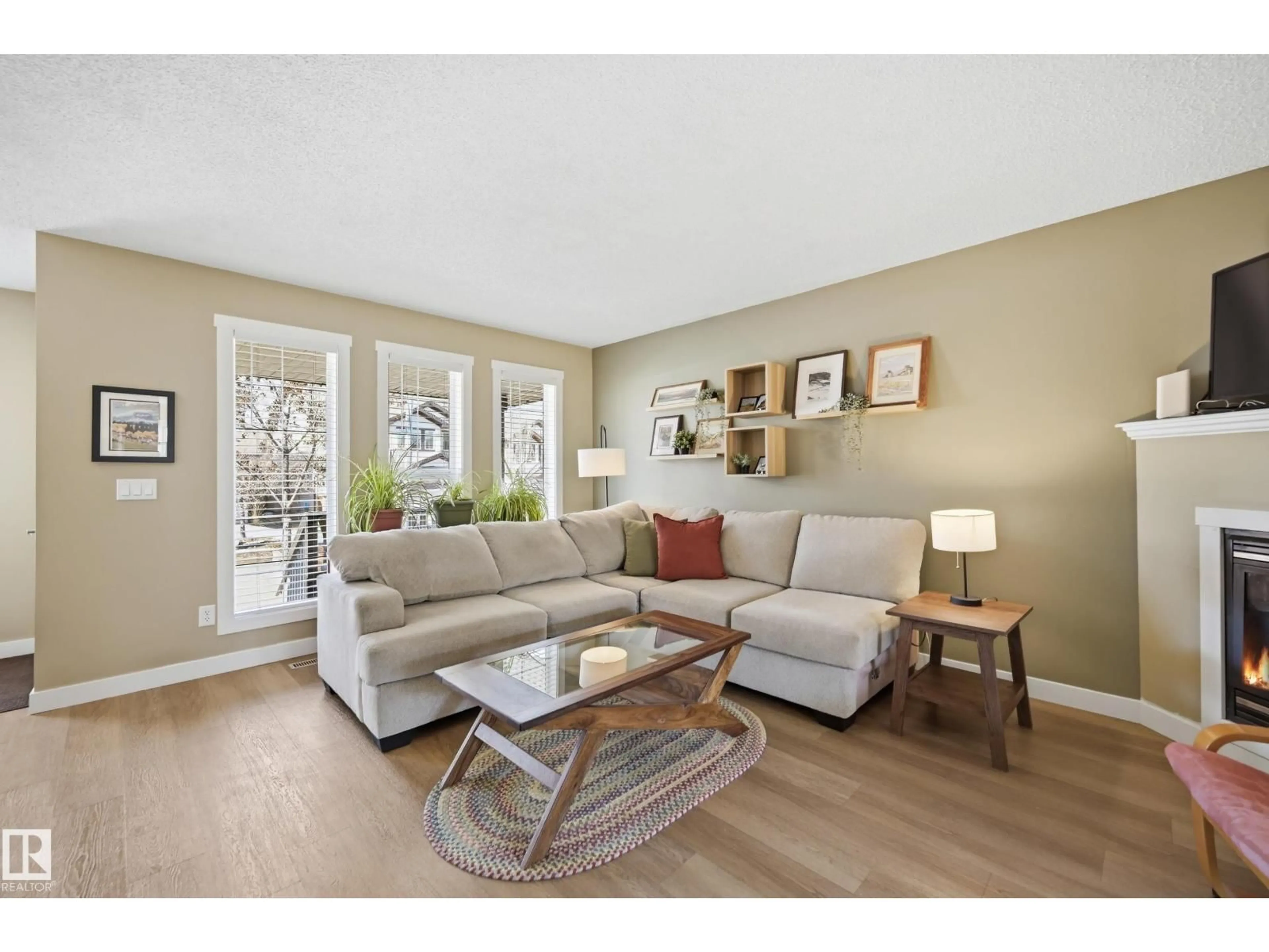 Living room with furniture, wood/laminate floor for 14 VIVIAN WY, Spruce Grove Alberta T7X0G9