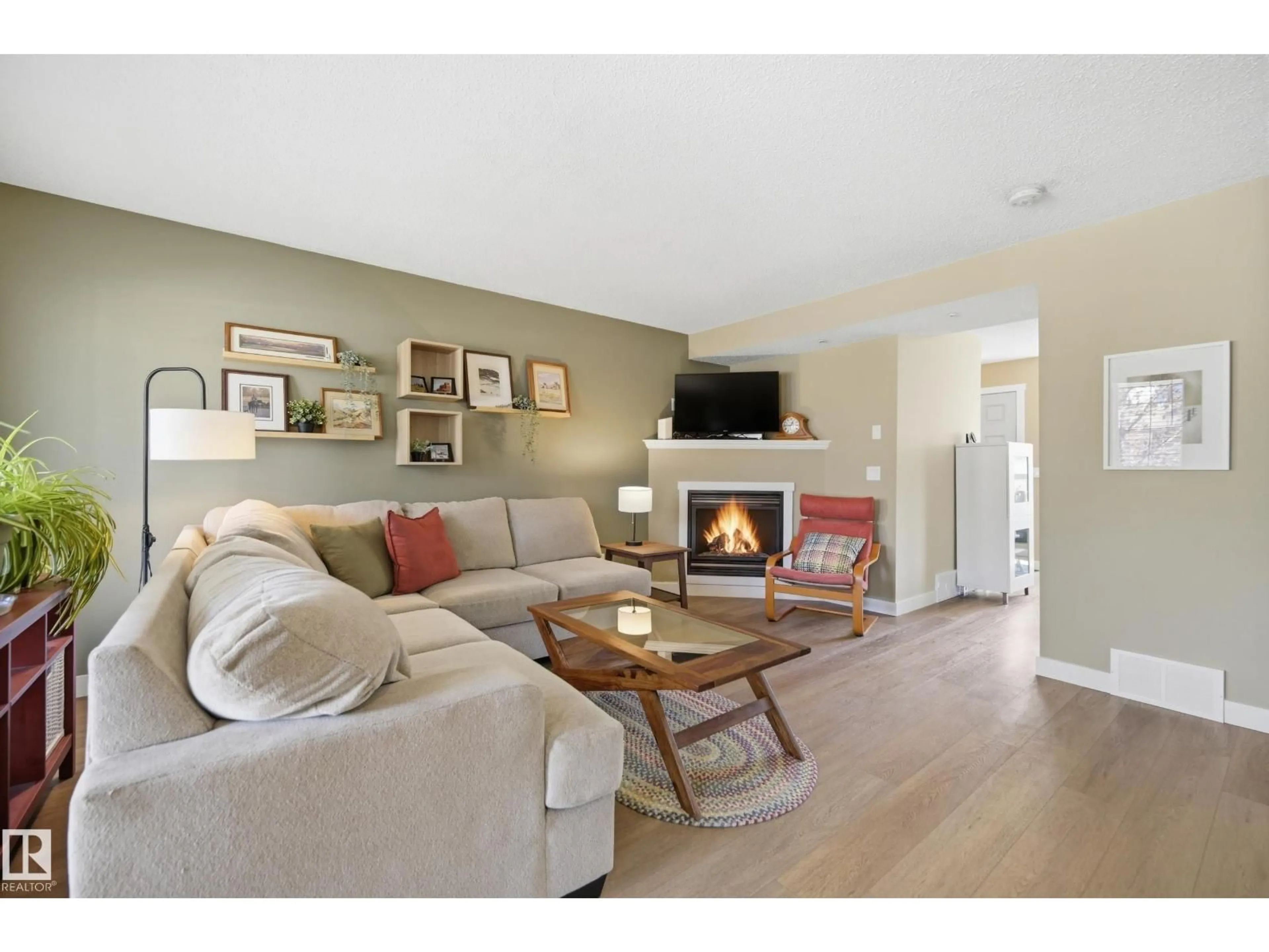 Living room with furniture, wood/laminate floor for 14 VIVIAN WY, Spruce Grove Alberta T7X0G9