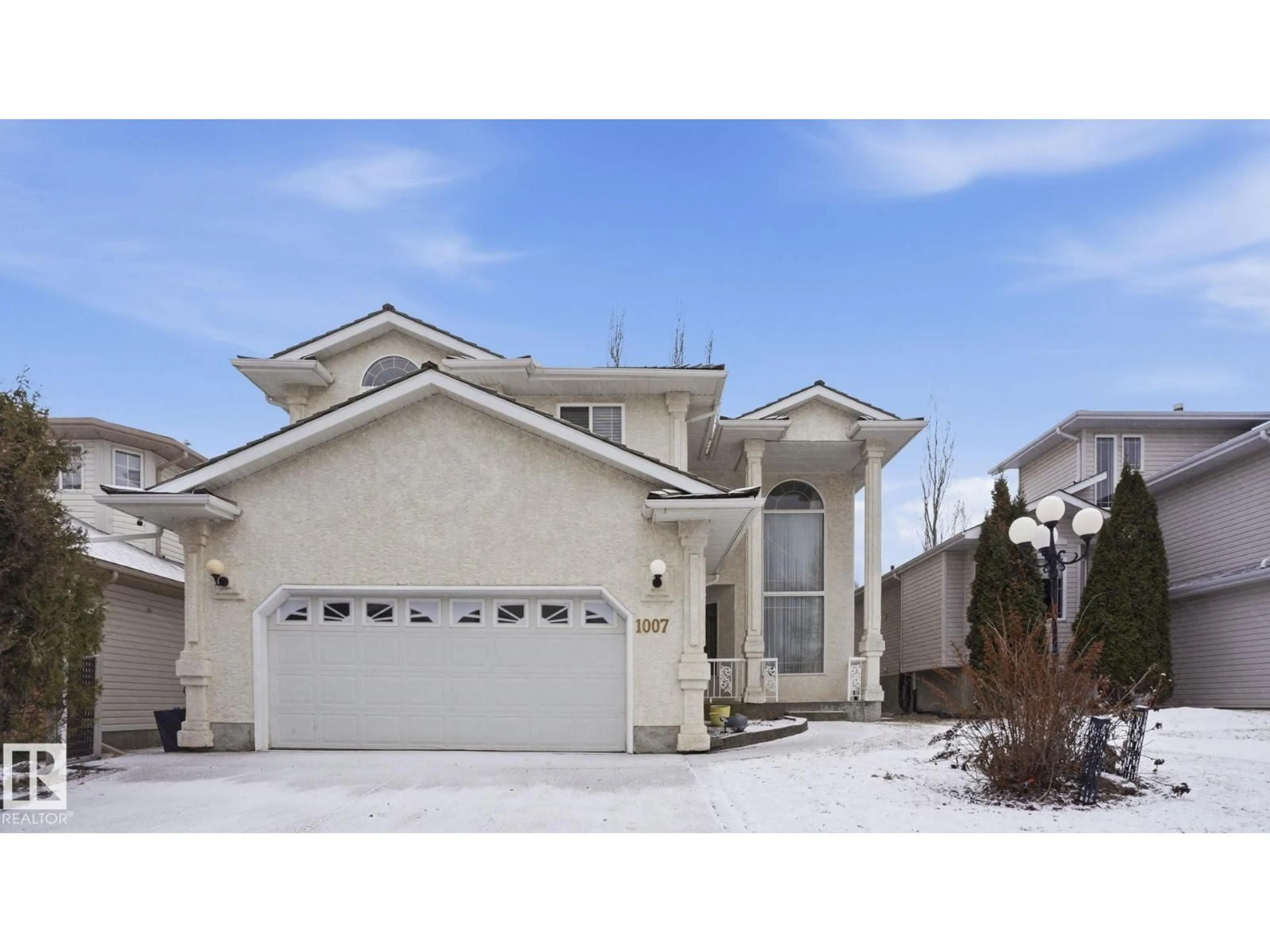 Home with vinyl exterior material, street for 1007 ORMSBY CR, Edmonton Alberta T5T6G8