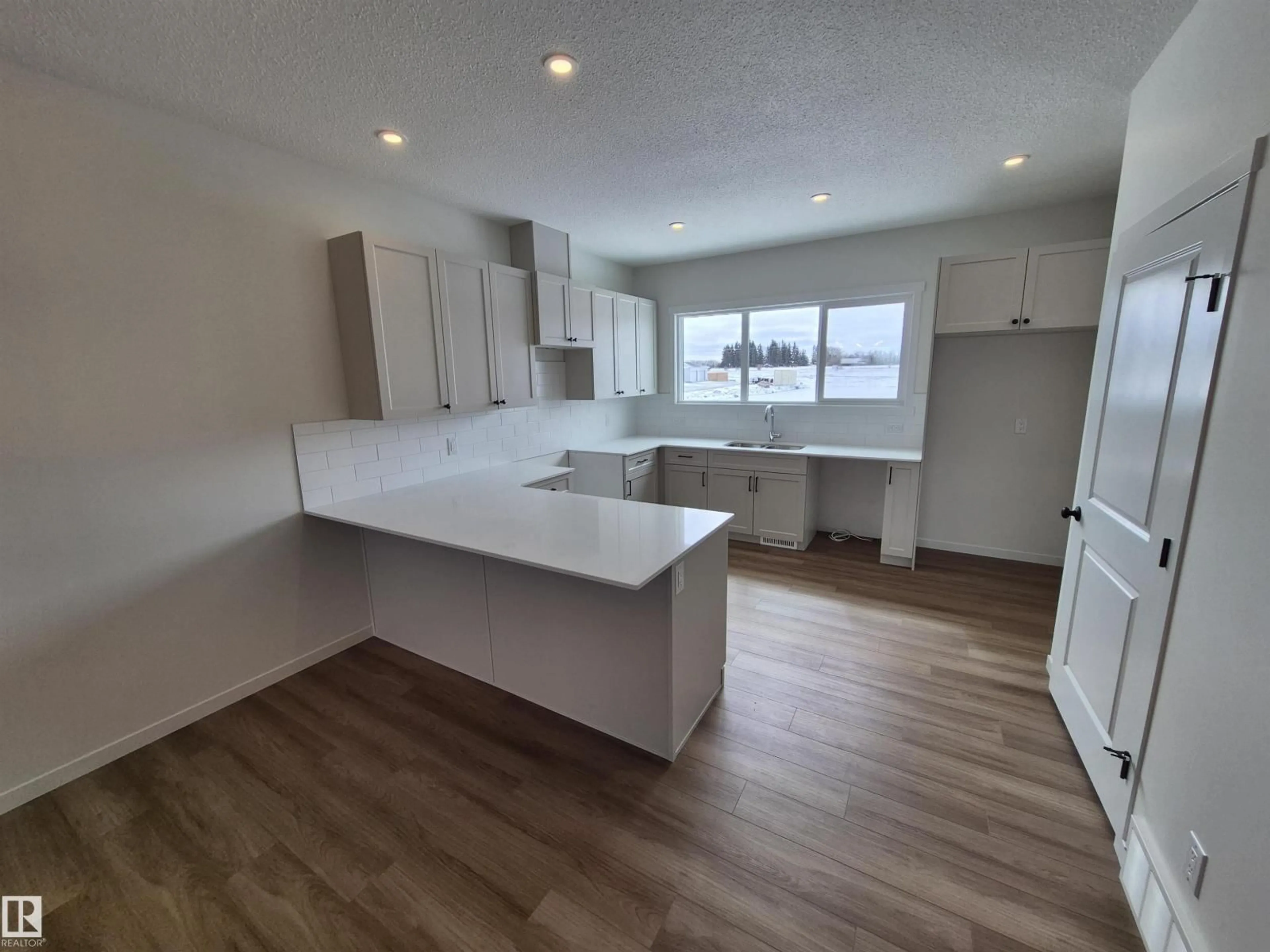 Open concept kitchen, wood/laminate floor for 1084 MCLEOD AV, Spruce Grove Alberta T7X4G8