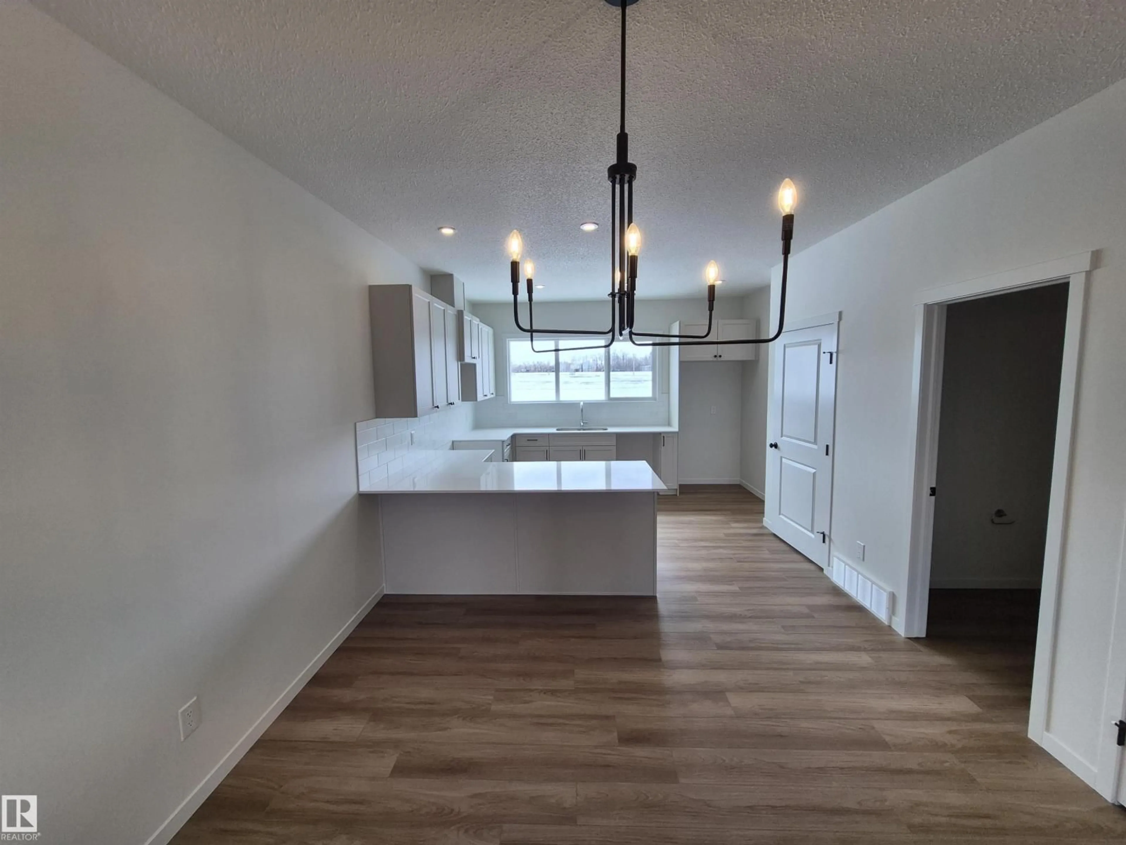 Open concept kitchen, wood/laminate floor for 1084 MCLEOD AV, Spruce Grove Alberta T7X4G8