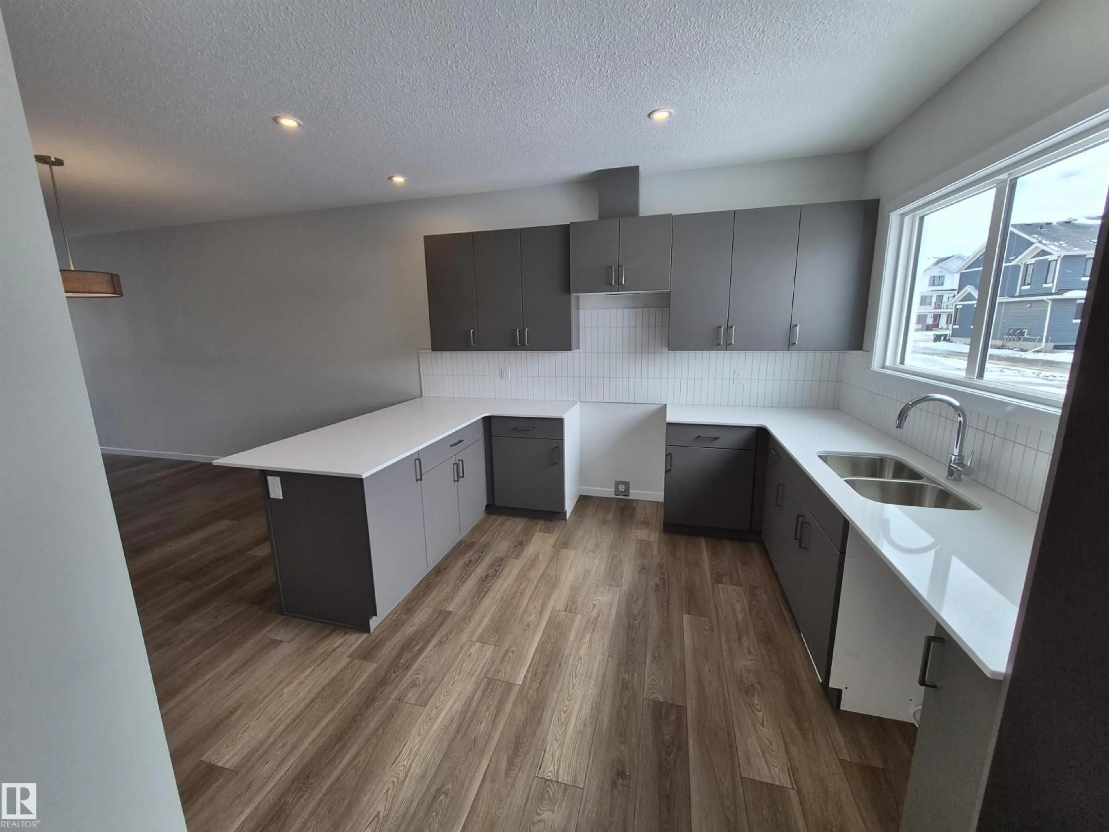 Open concept kitchen, wood/laminate floor for 1088 MCLEOD AV, Spruce Grove Alberta T7X4G8