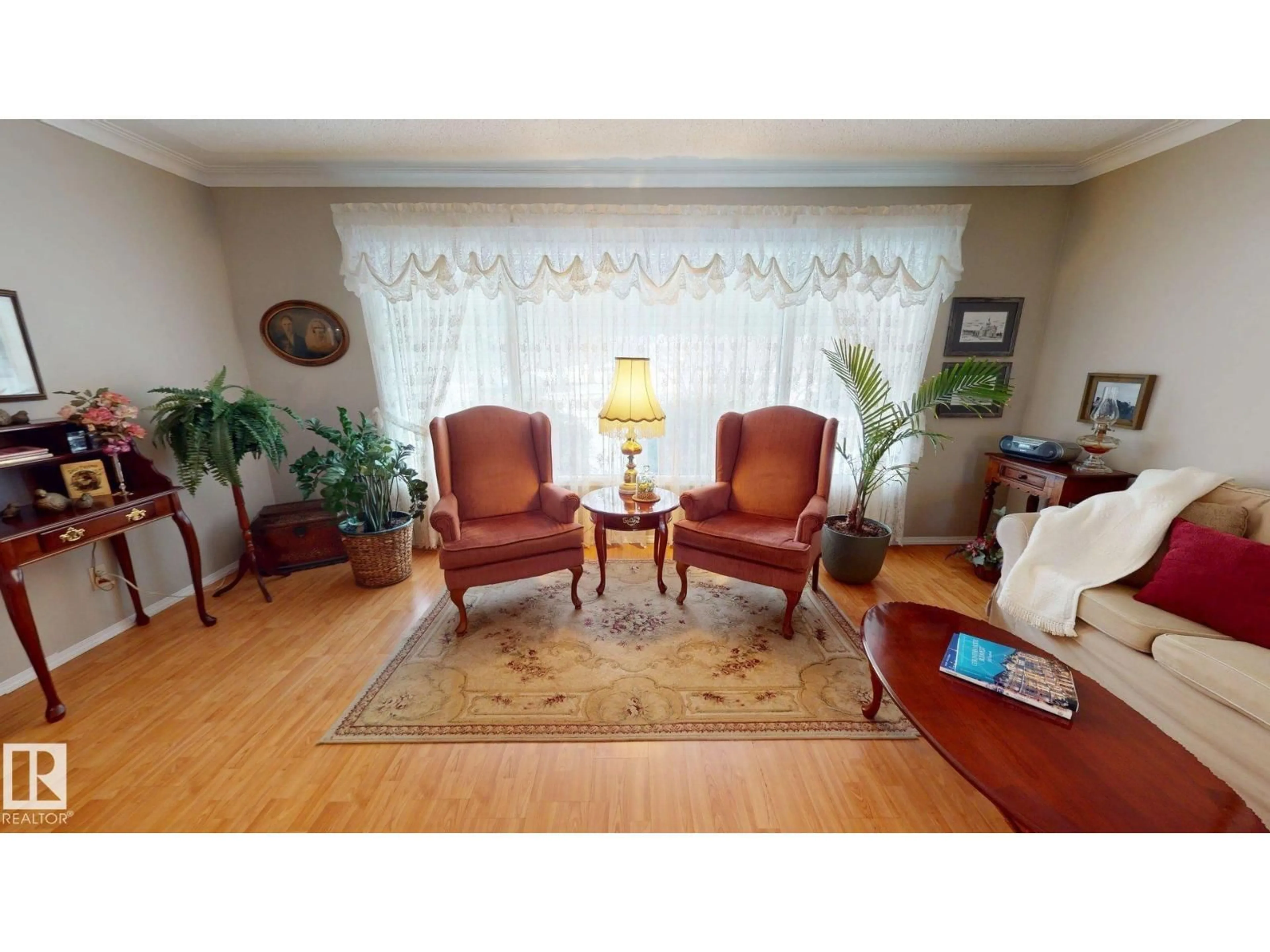 Living room with furniture, wood/laminate floor for 13515 129 ST, Edmonton Alberta T5L1K4