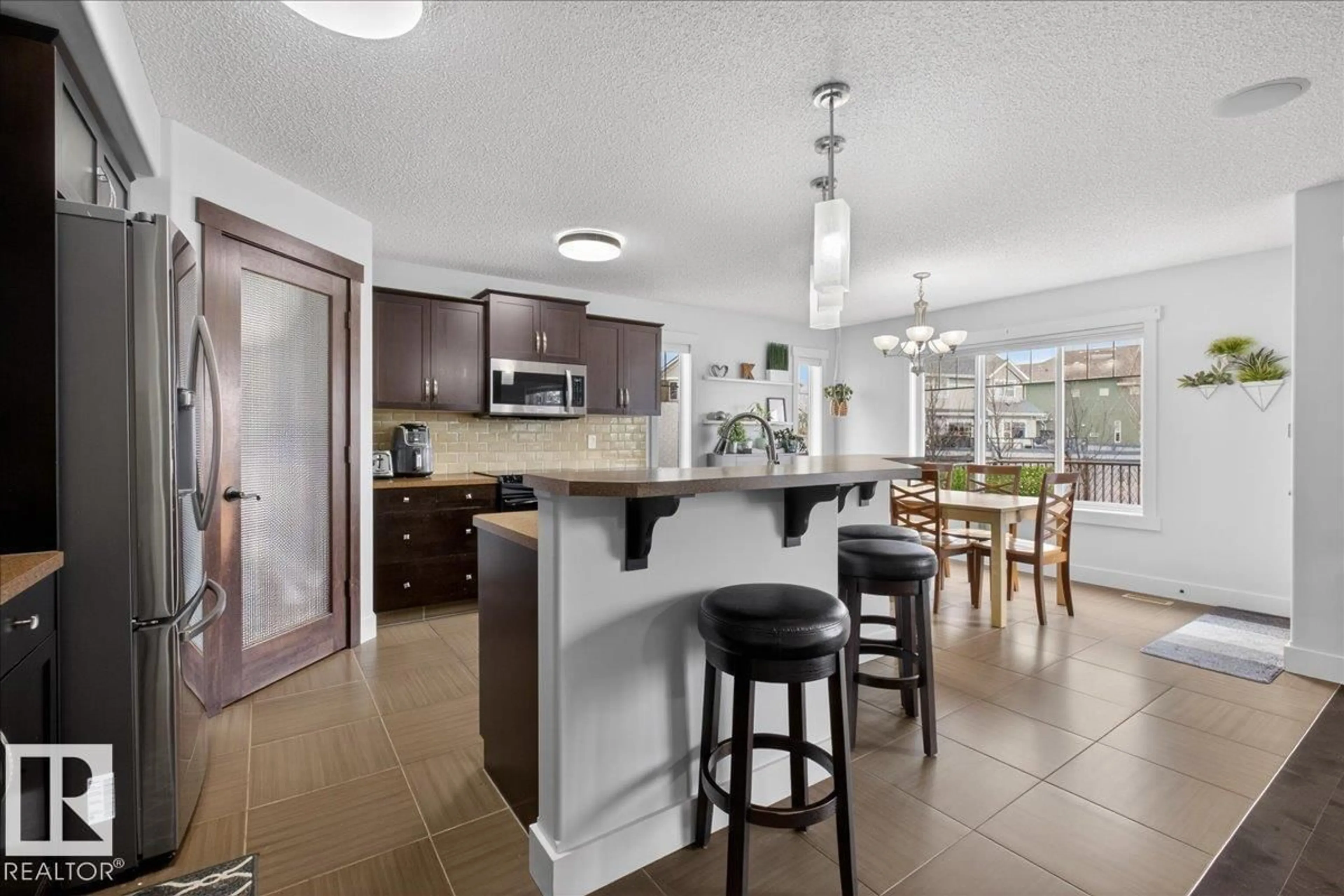 Open concept kitchen, ceramic/tile floor for SW - 8132 16A AV, Edmonton Alberta T6X0H8