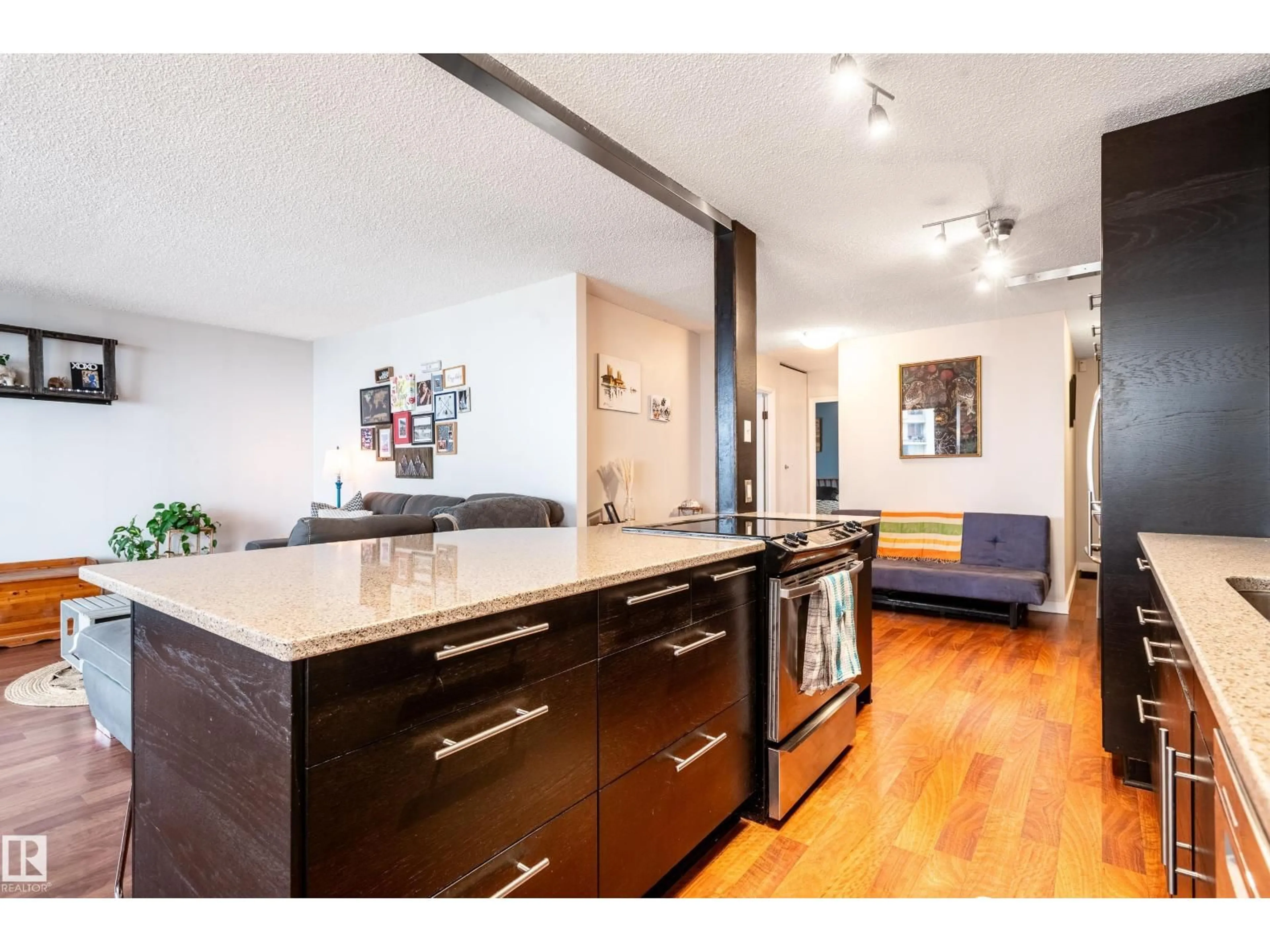 Open concept kitchen, wood/laminate floor for 706 - 10135 SASKATCHEWAN DR, Edmonton Alberta T6E4Y9