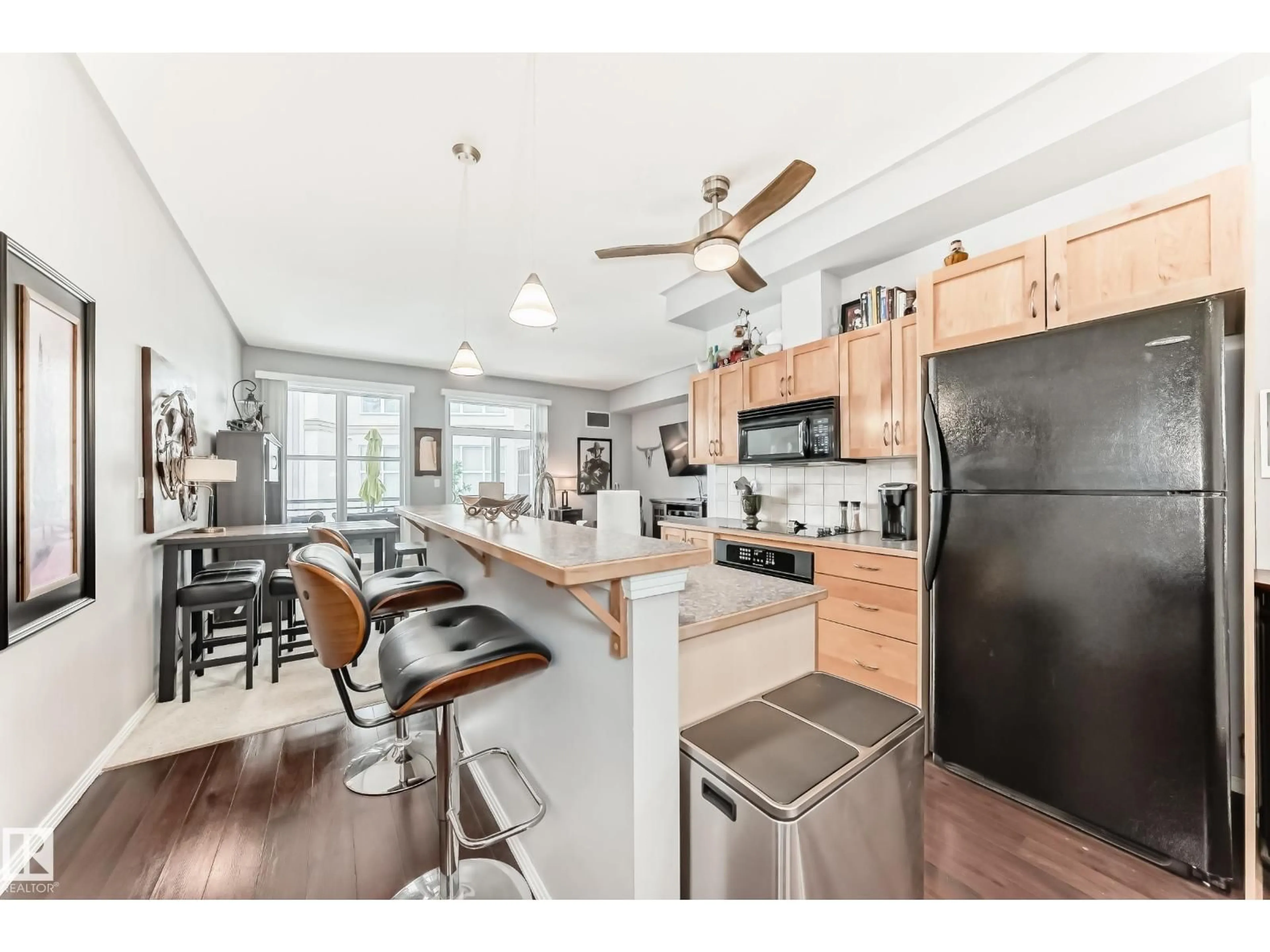 Open concept kitchen, wood/laminate floor for NW - 350 4827 104A ST, Edmonton Alberta T6H0R5