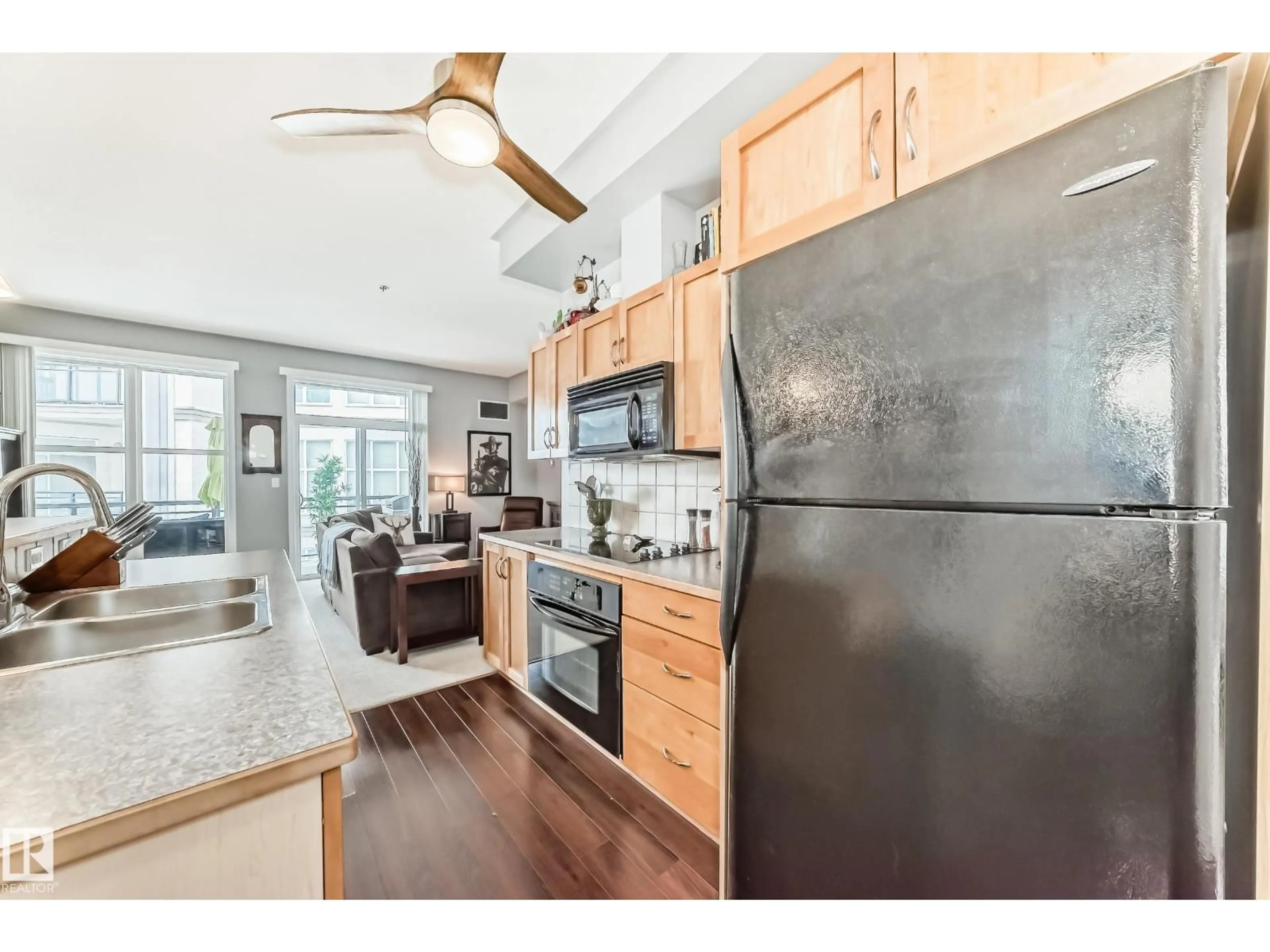 Open concept kitchen, wood/laminate floor for NW - 350 4827 104A ST, Edmonton Alberta T6H0R5