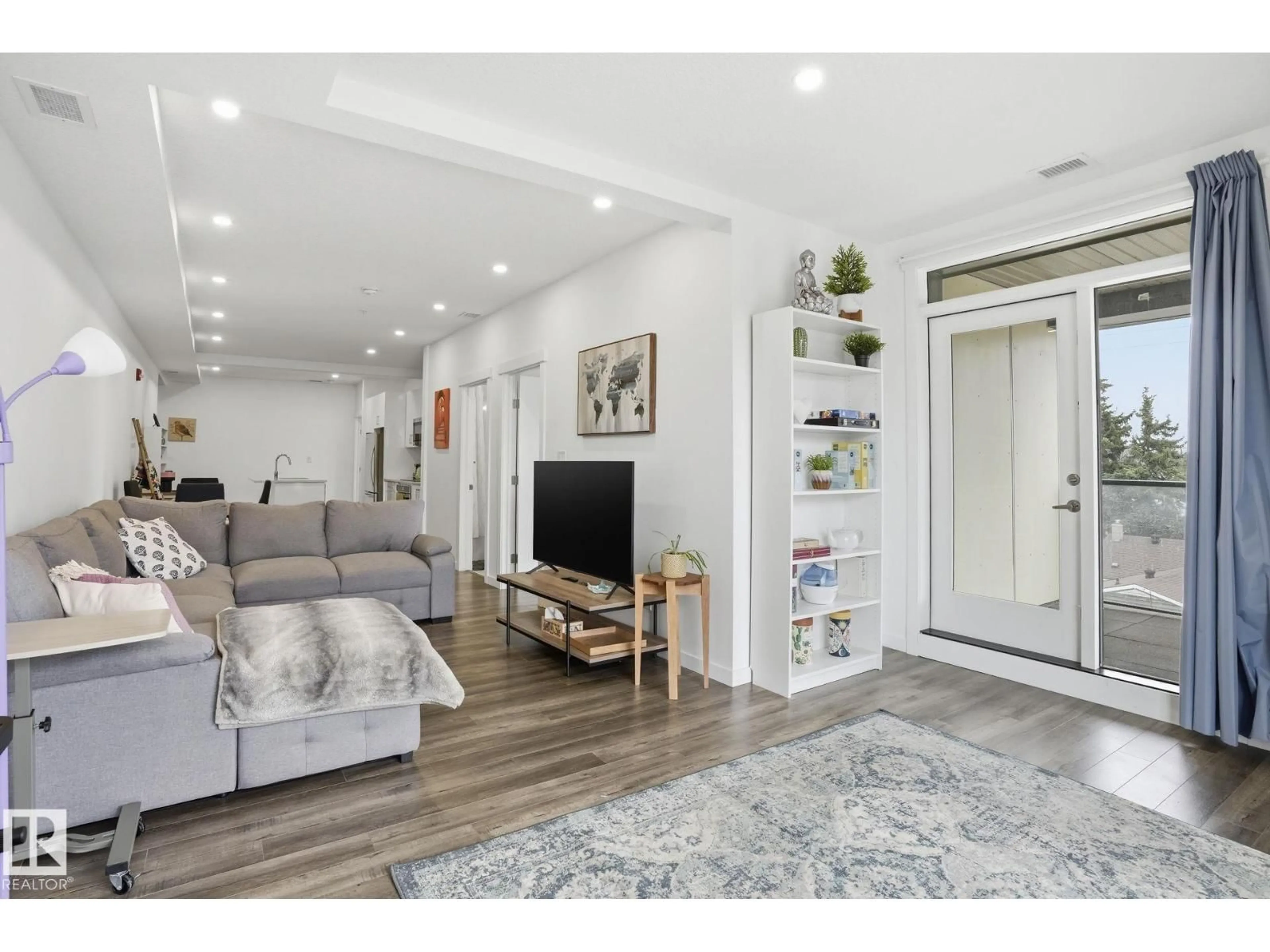 Living room with furniture, wood/laminate floor for 311 - 11503 76 AV, Edmonton Alberta T6G0K6