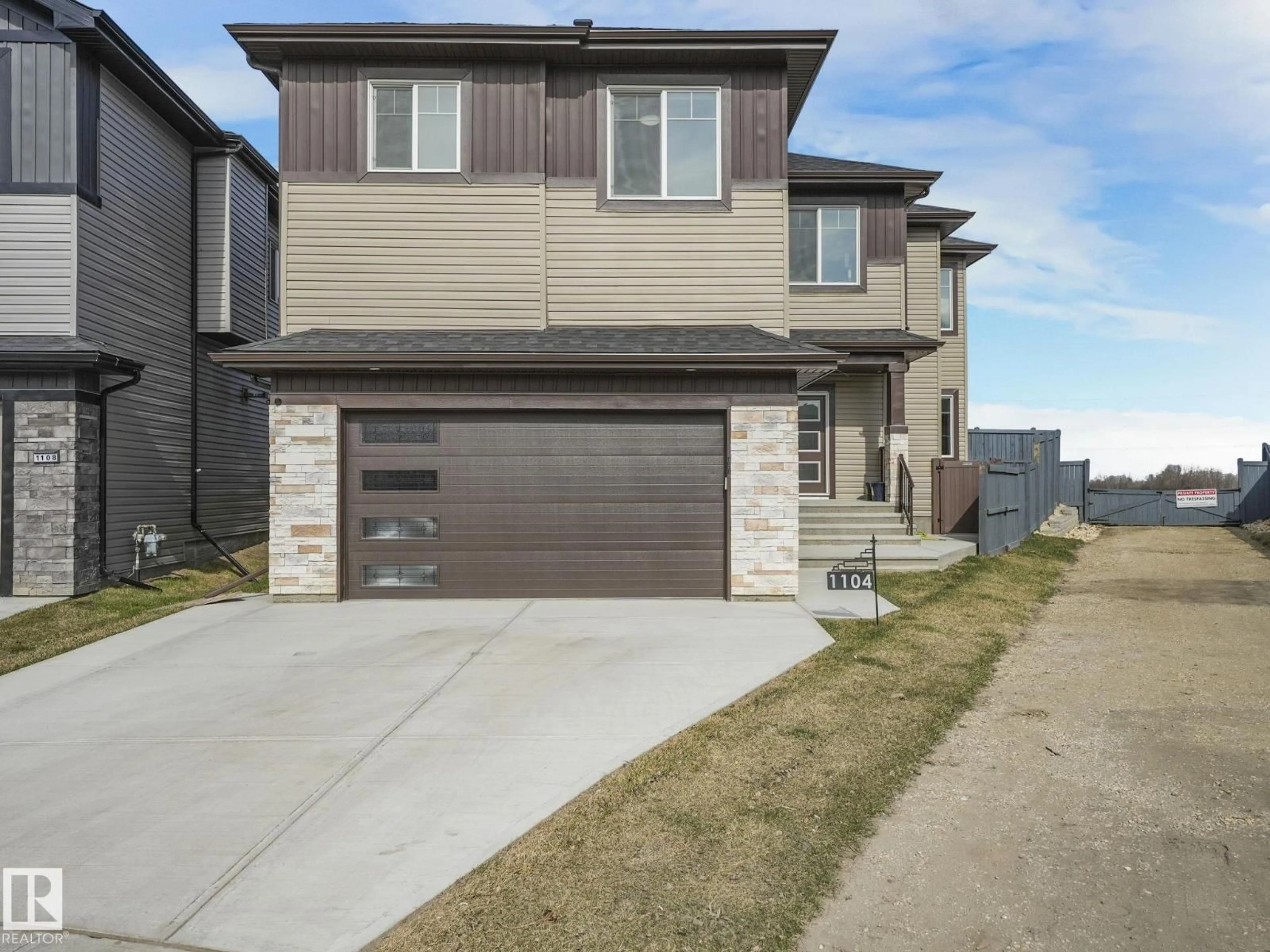 Home with brick exterior material, street for 1104 152 AV, Edmonton Alberta T5Y4C8