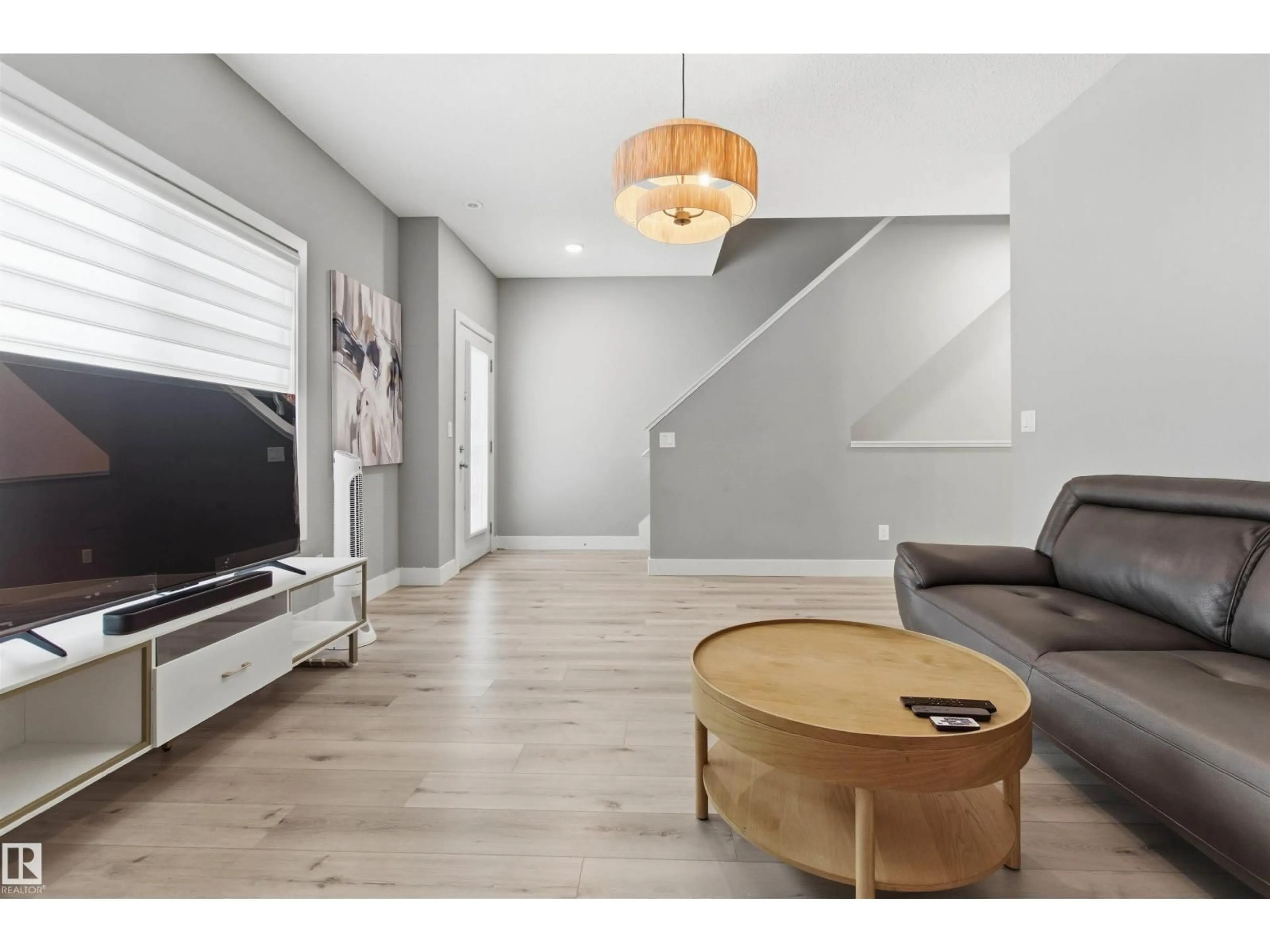 Living room with furniture, wood/laminate floor for #99 - 804 WELSH DR, Edmonton Alberta T6X1Y8