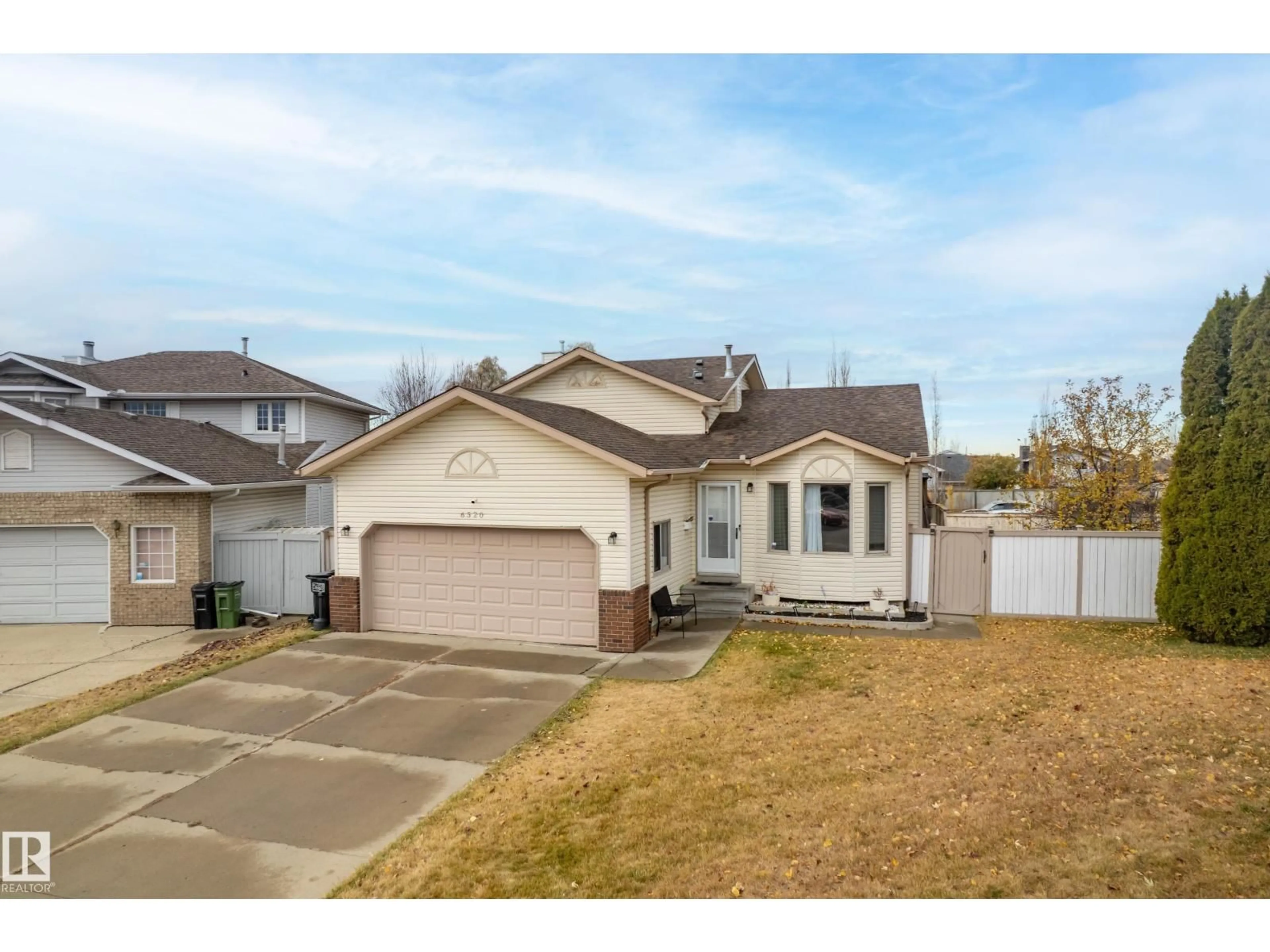 Home with vinyl exterior material, street for 6520 154 AV, Edmonton Alberta T5Y2N7