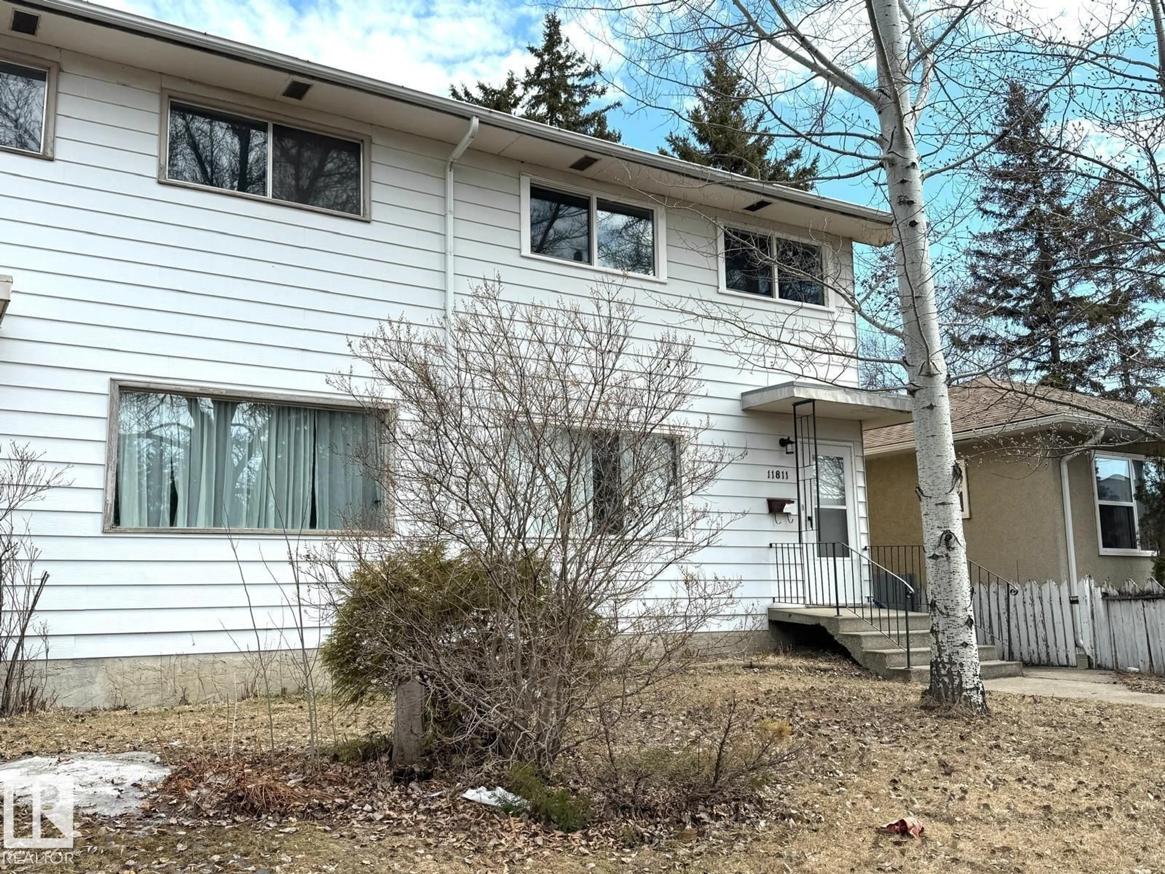 Home with vinyl exterior material, street for 11811 44 ST, Edmonton Alberta T5W2S4