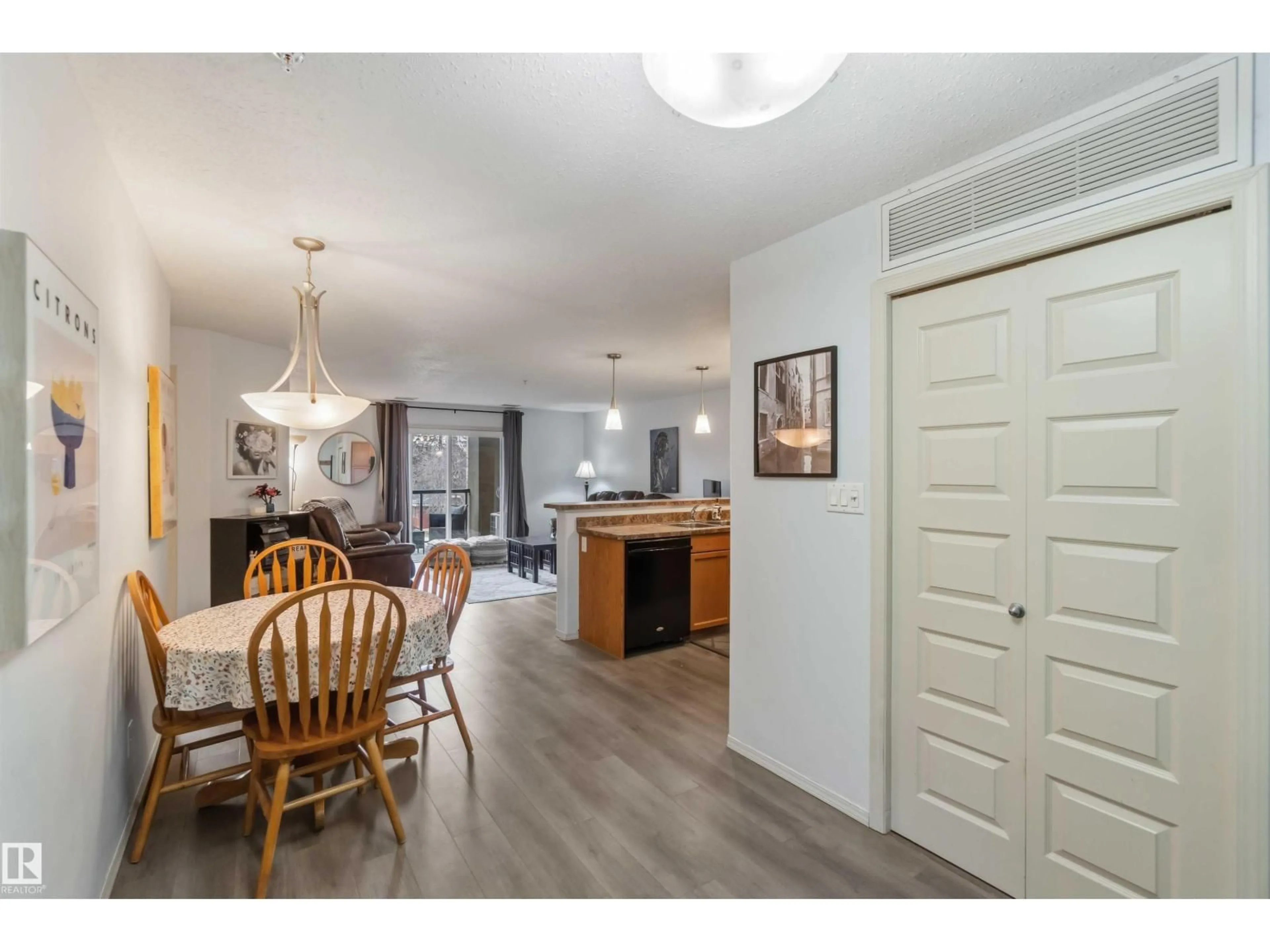 Open concept kitchen, wood/laminate floor for #214 - 7909 71 ST, Edmonton Alberta T6B3P5