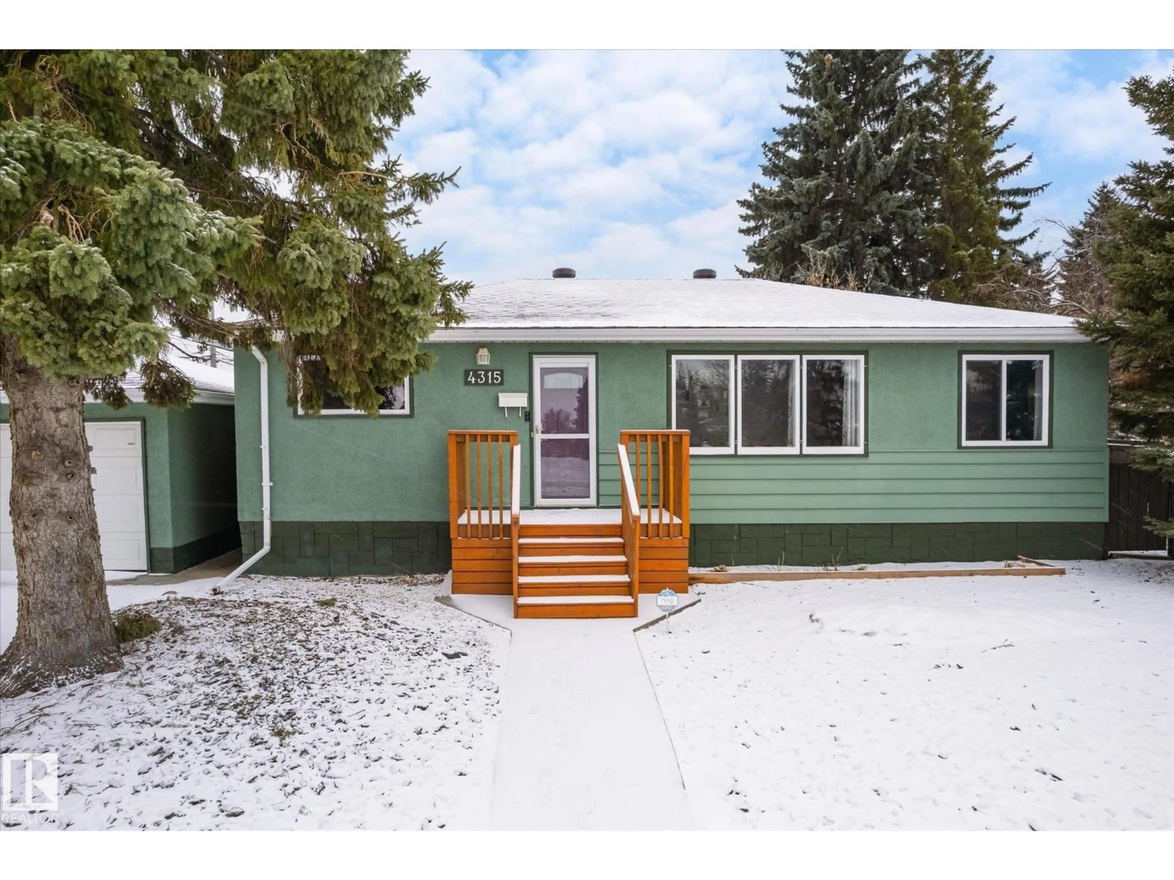 Home with vinyl exterior material, street for 4315 105A AV, Edmonton Alberta T6A1B7