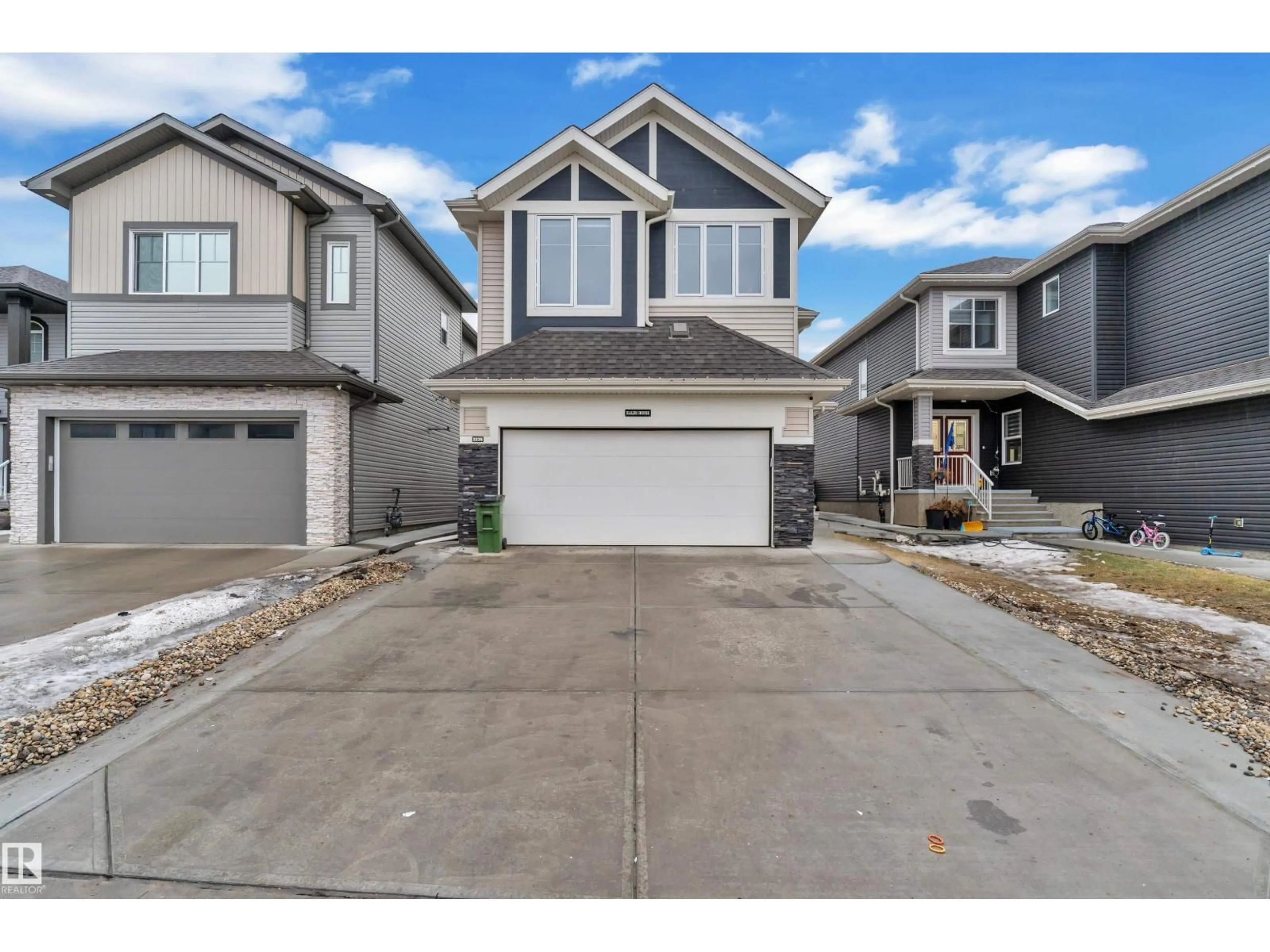 Home with vinyl exterior material, street for 3235 13 AV, Edmonton Alberta T6T0Z4