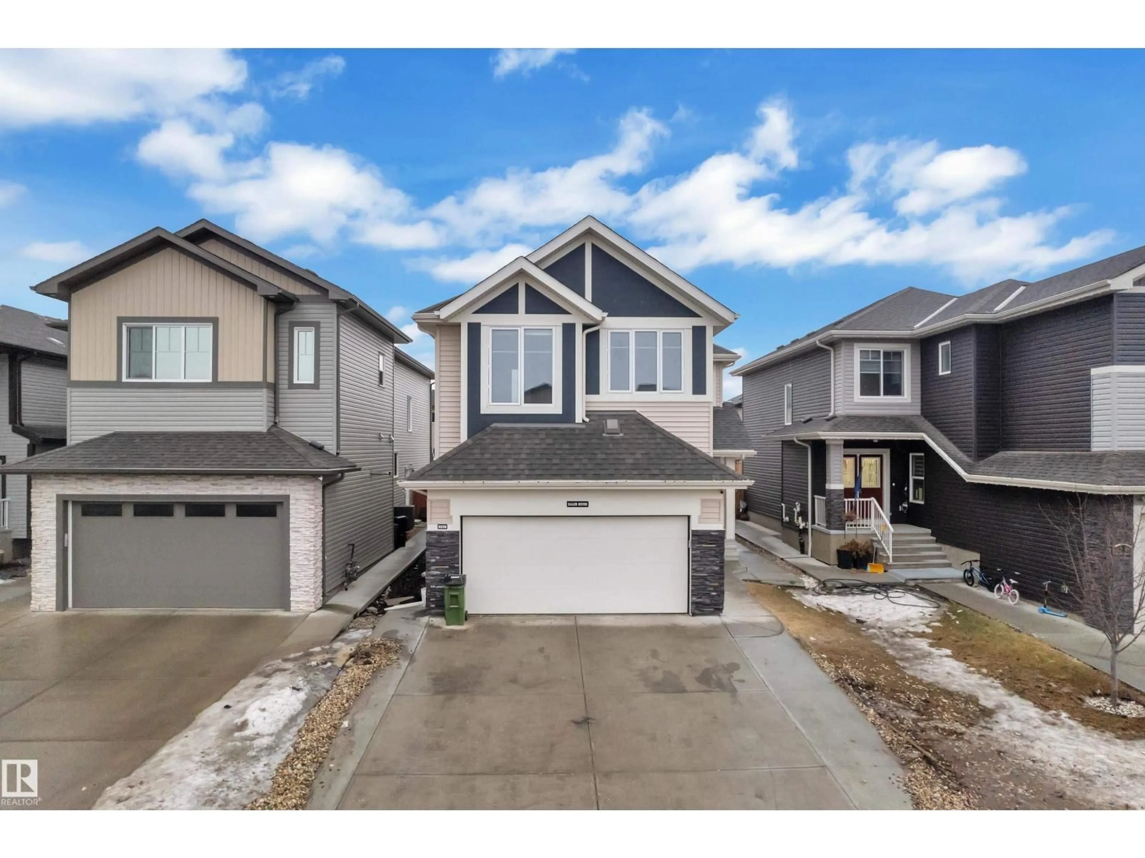 Home with vinyl exterior material, street for 3235 13 AV, Edmonton Alberta T6T0Z4
