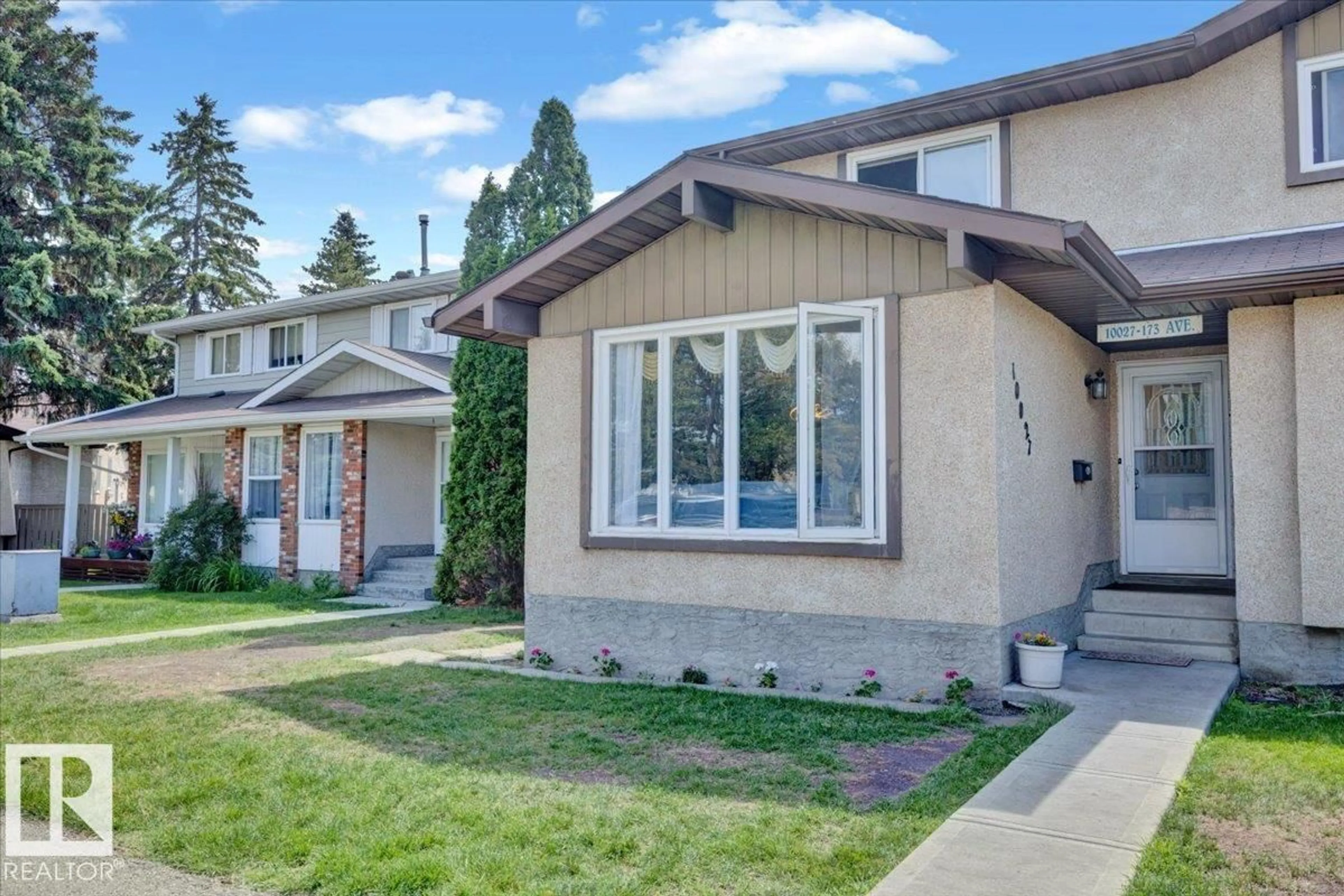 Home with vinyl exterior material, street for 10027 173 AV, Edmonton Alberta T5X3Y1